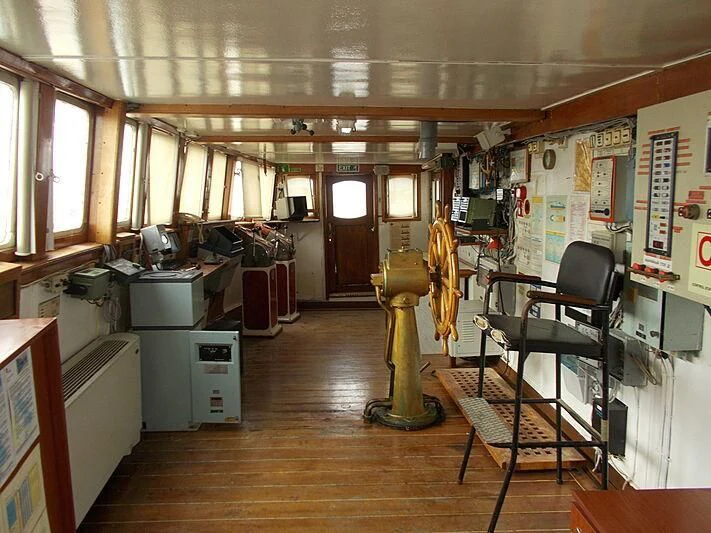 a room with a desk and chairs aboard EVANGELIYA Yacht for Sale