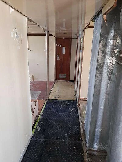 a hallway with a door aboard EVANGELIYA Yacht for Sale