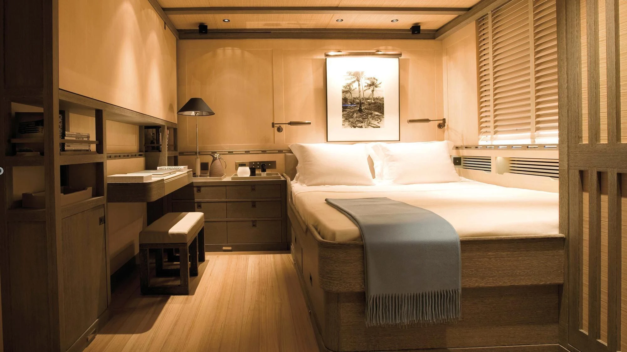 a room with a bed and a desk aboard ROXANE Yacht for Sale