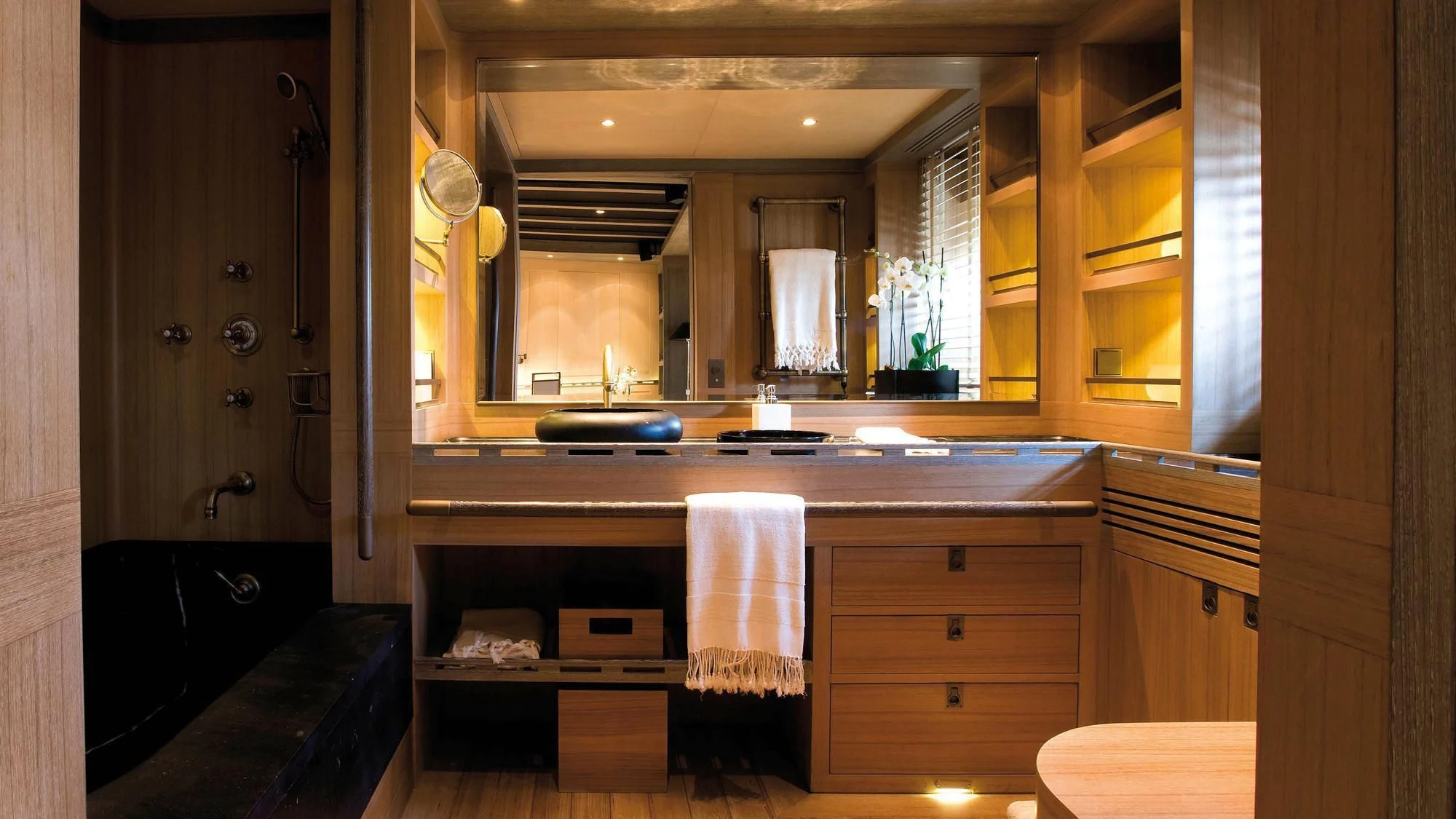 a bathroom with a large mirror aboard ROXANE Yacht for Sale