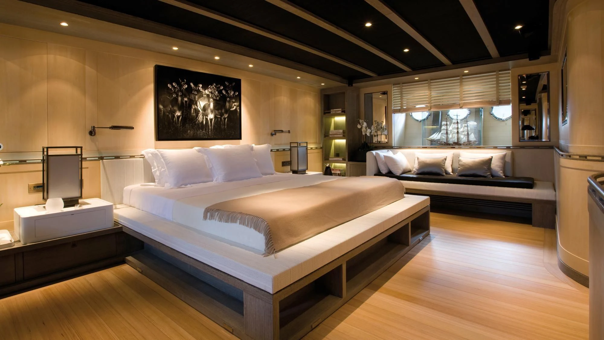 a room with a bed and a mirror aboard ROXANE Yacht for Sale