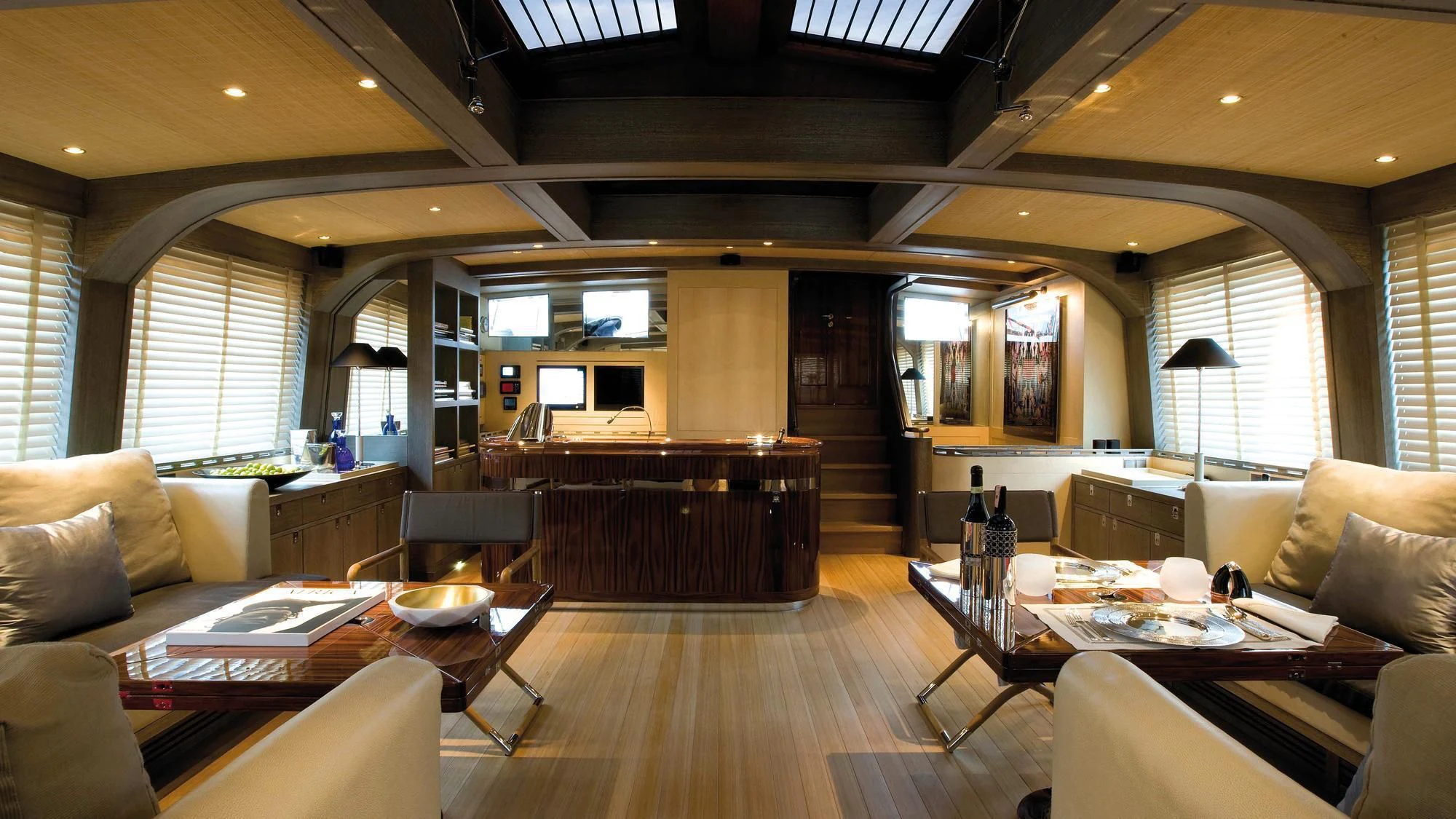 a living room with a wood floor aboard ROXANE Yacht for Sale