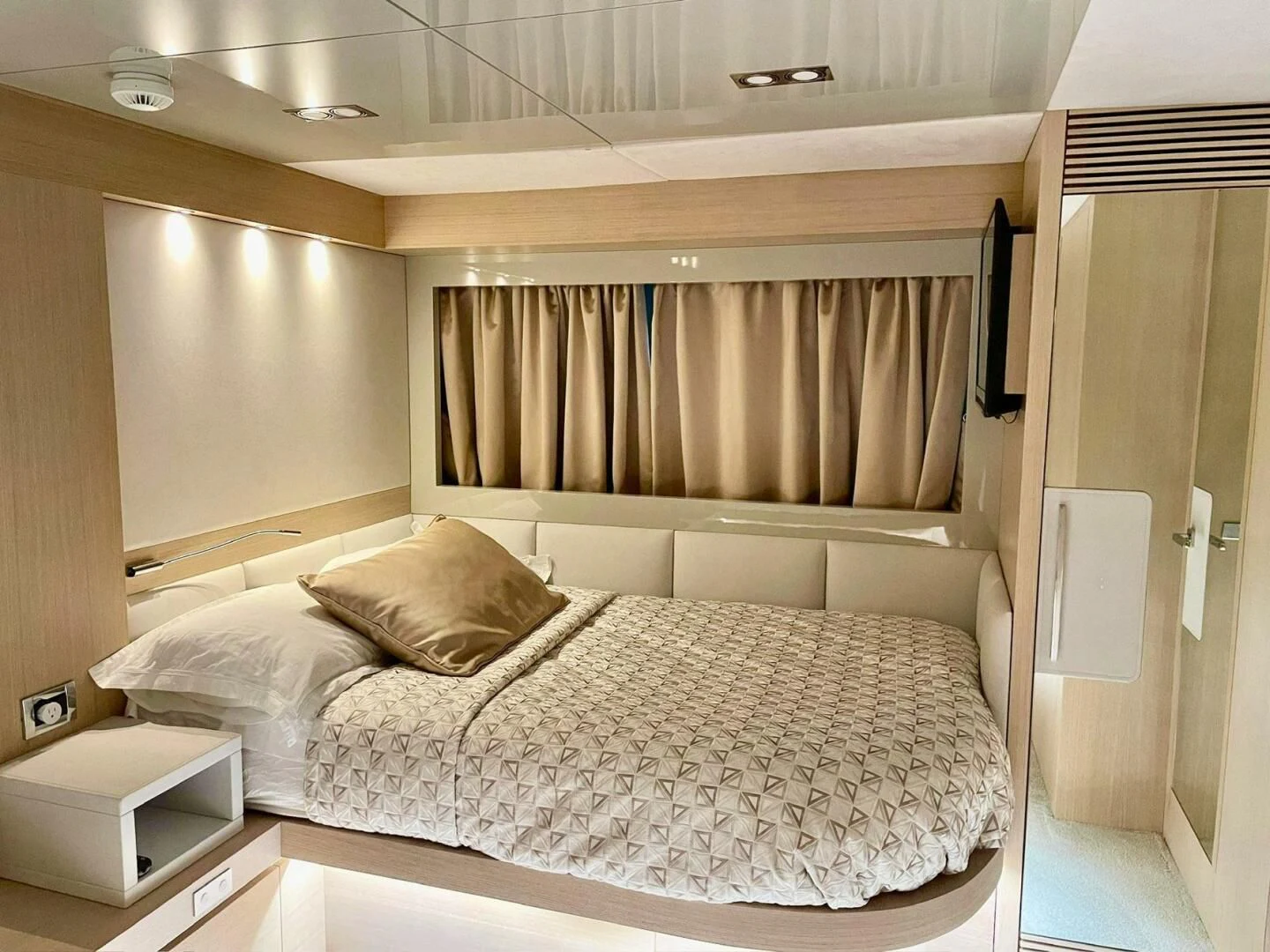 a bed with white sheets aboard SEA METRI V Yacht for Sale