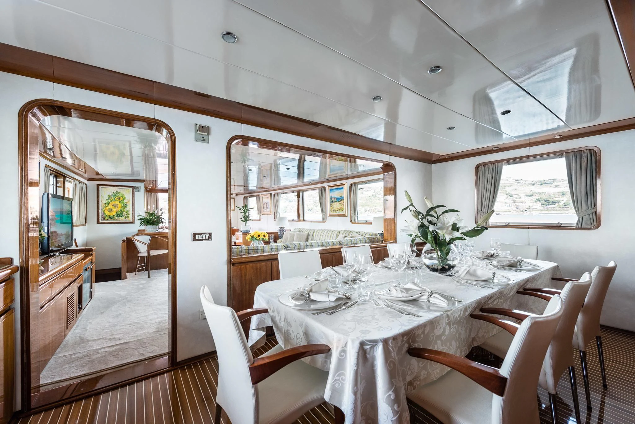 a dining room with a table and chairs aboard SOUTH PAW C Yacht for Sale