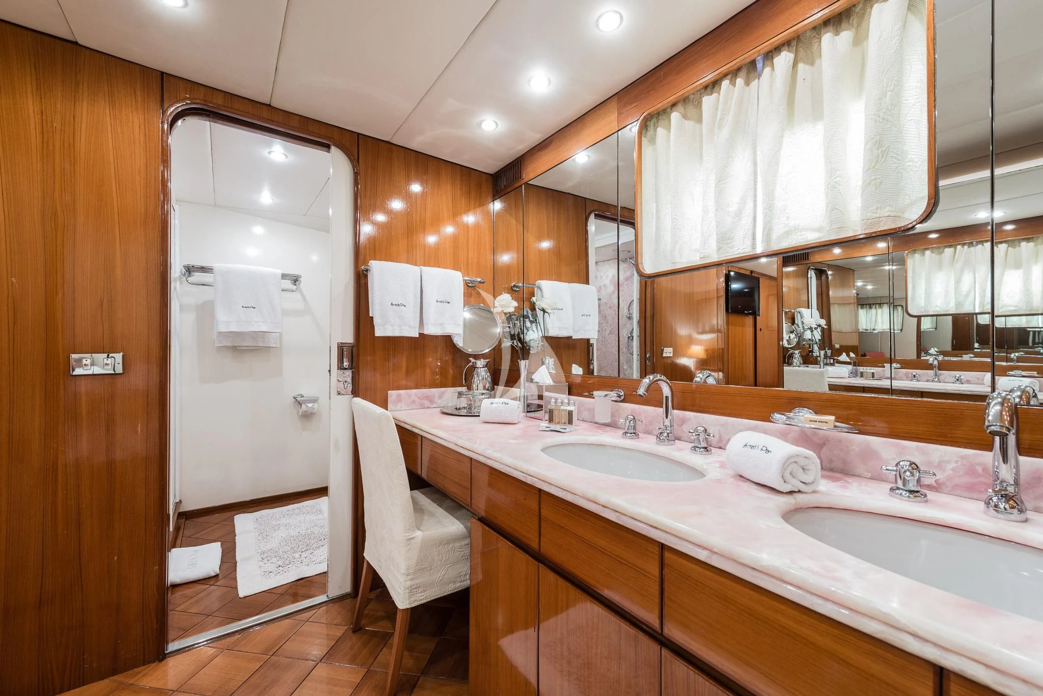 a bathroom with a large mirror aboard SOUTH PAW C Yacht for Sale