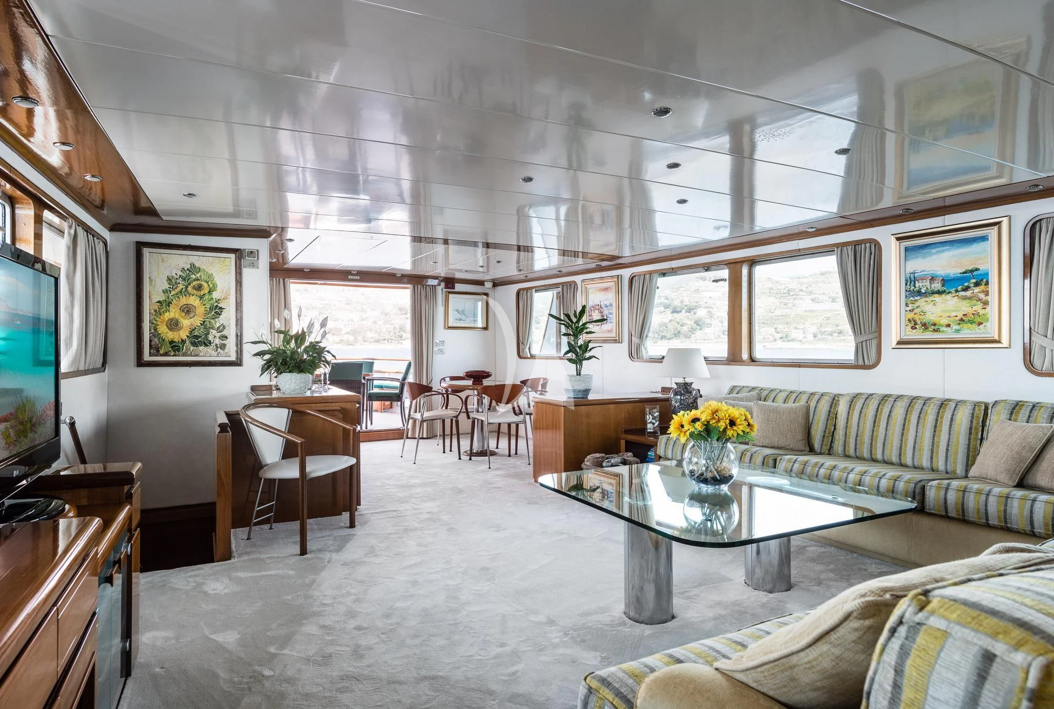 a living room with a large window aboard SOUTH PAW C Yacht for Sale
