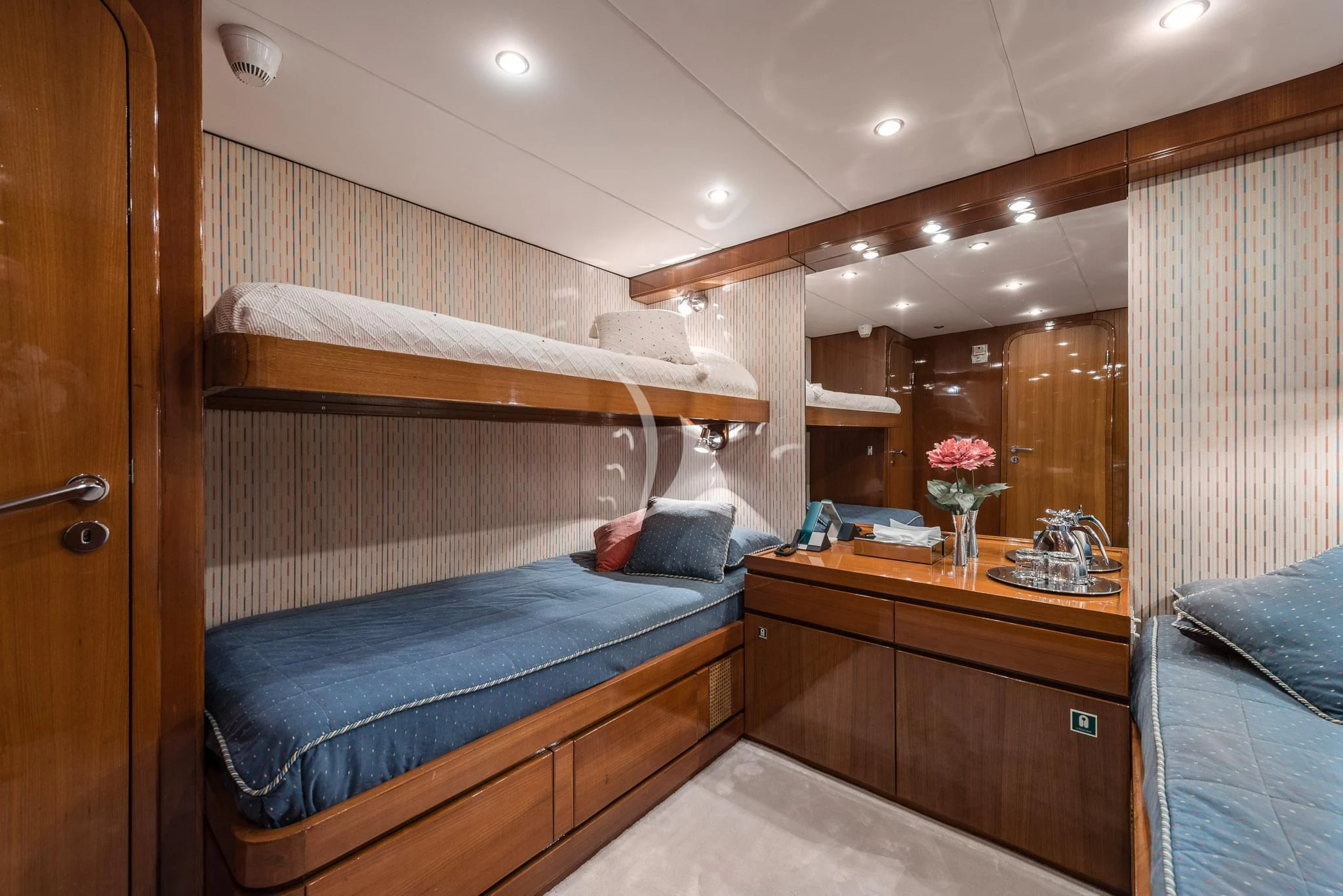 a bedroom with a bed and a dresser aboard SOUTH PAW C Yacht for Sale