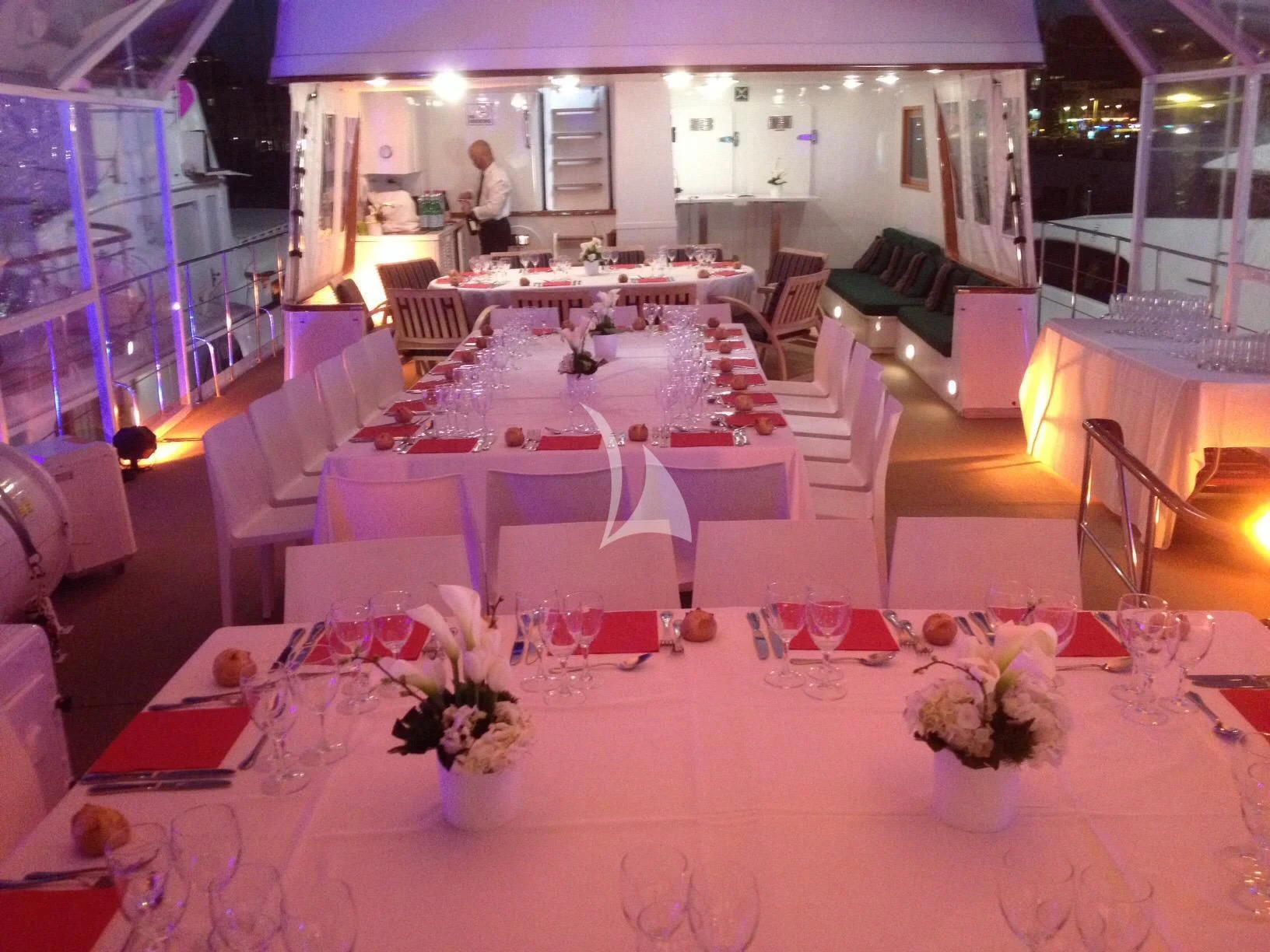 a room with tables and chairs aboard SOUTH PAW C Yacht for Sale