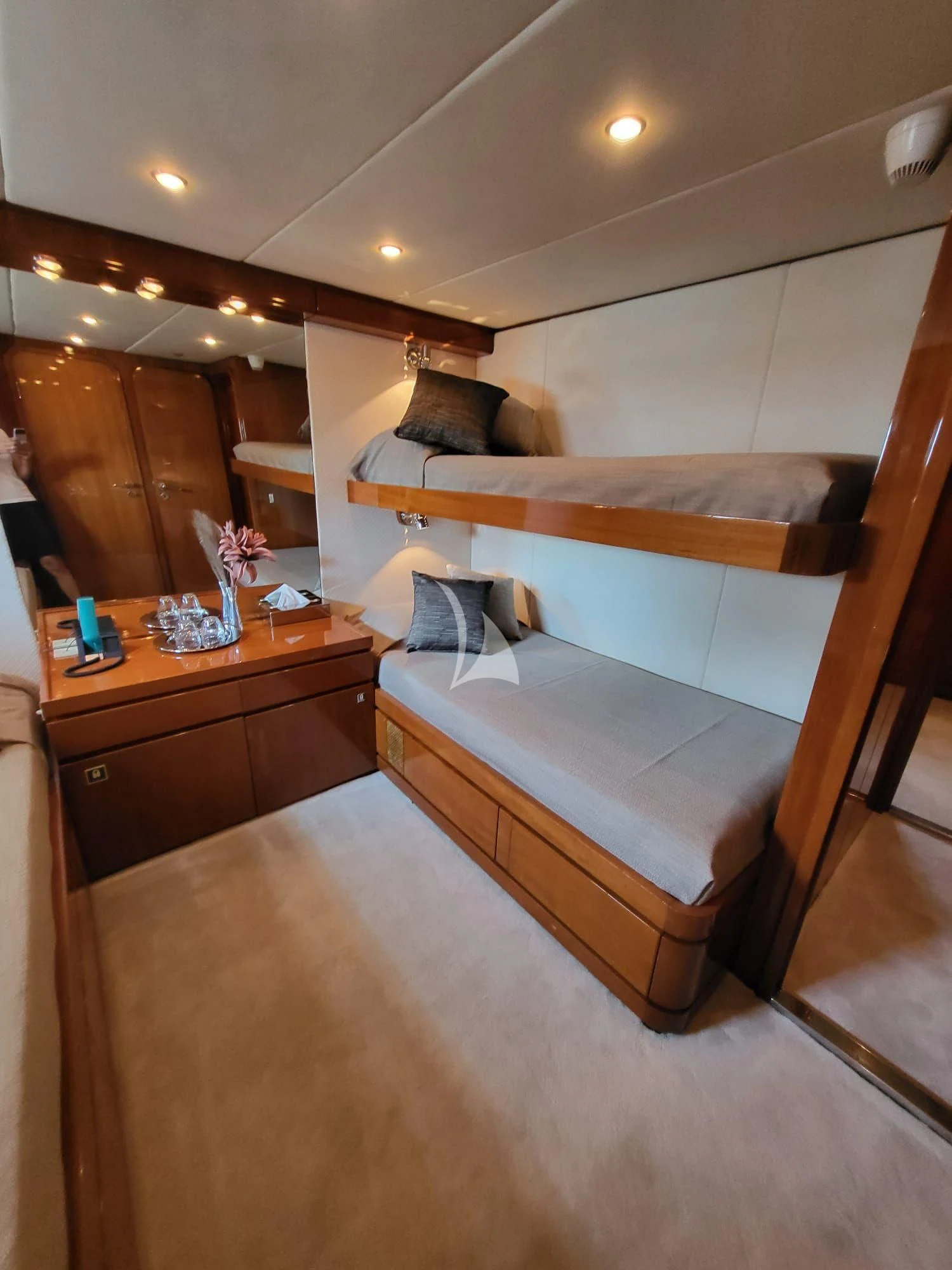 a room with a bed and a table aboard SOUTH PAW C Yacht for Sale