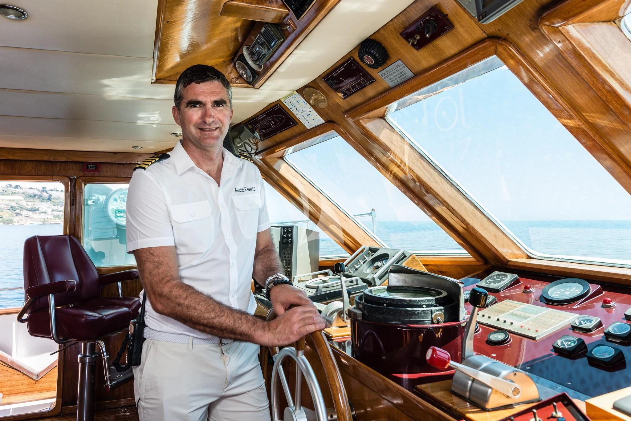 a person standing next to a machine aboard SOUTH PAW C Yacht for Sale