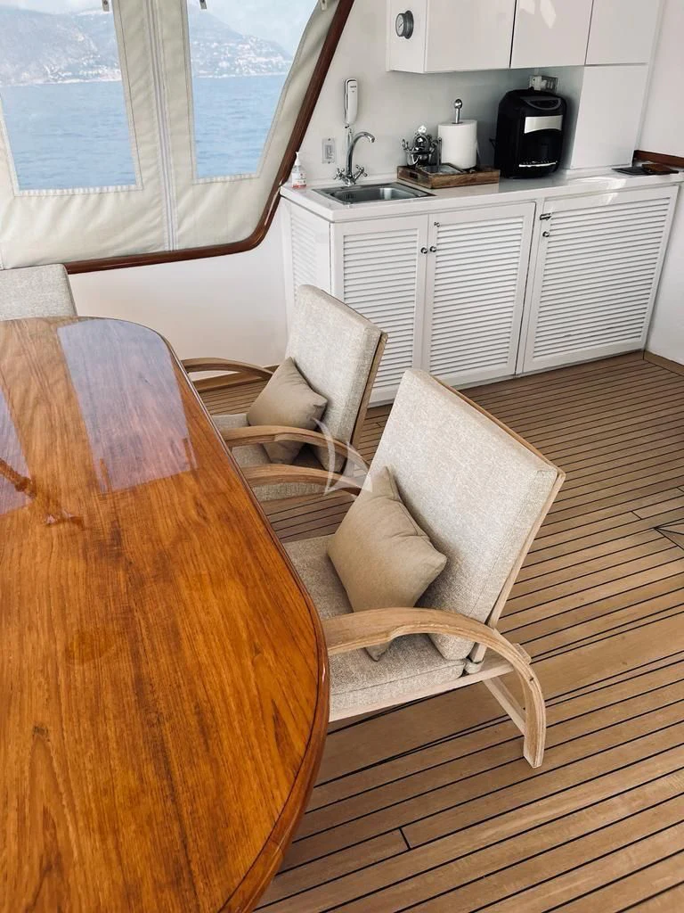 a chair and a table in a kitchen aboard SOUTH PAW C Yacht for Sale