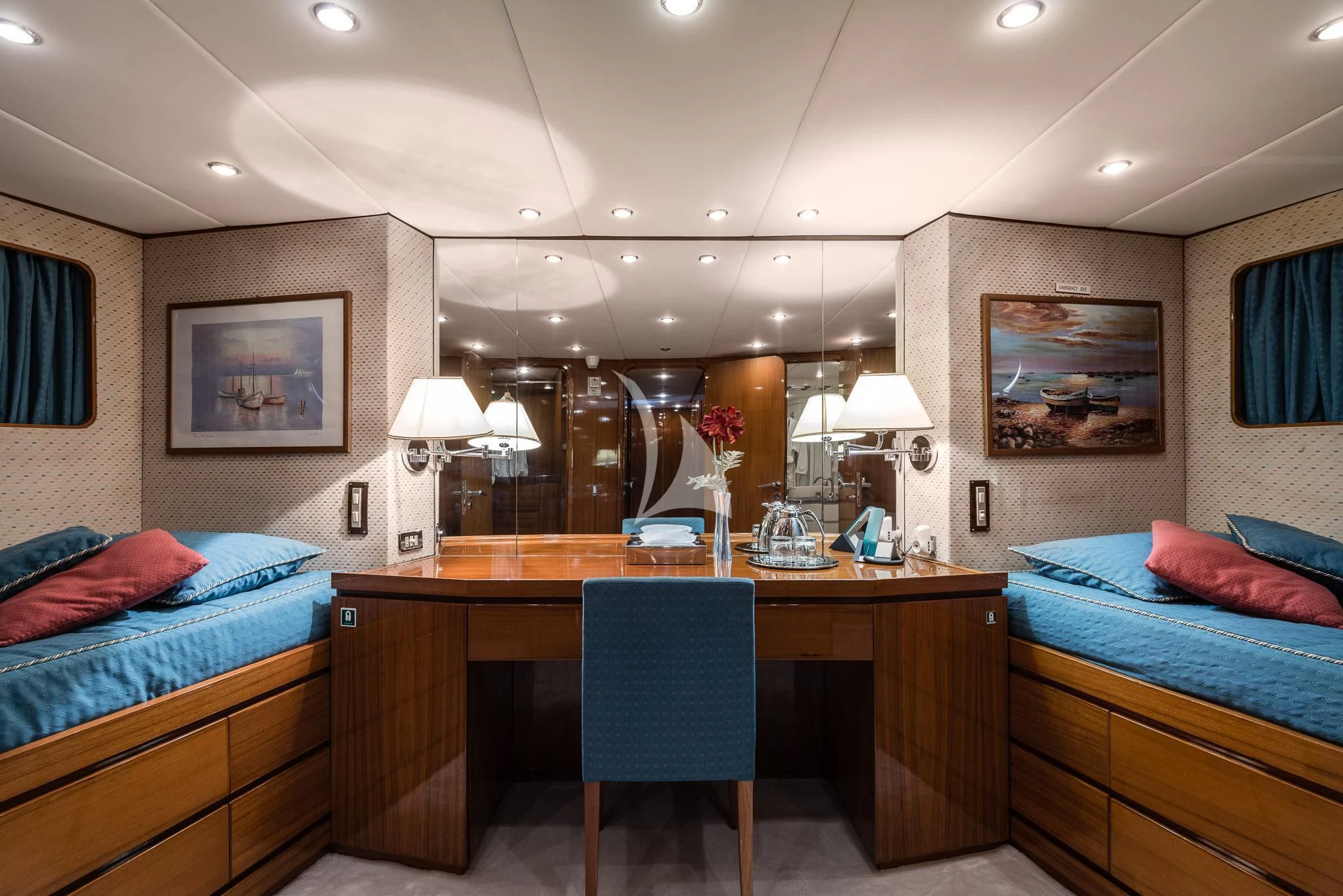a bedroom with a desk and a bed aboard SOUTH PAW C Yacht for Sale
