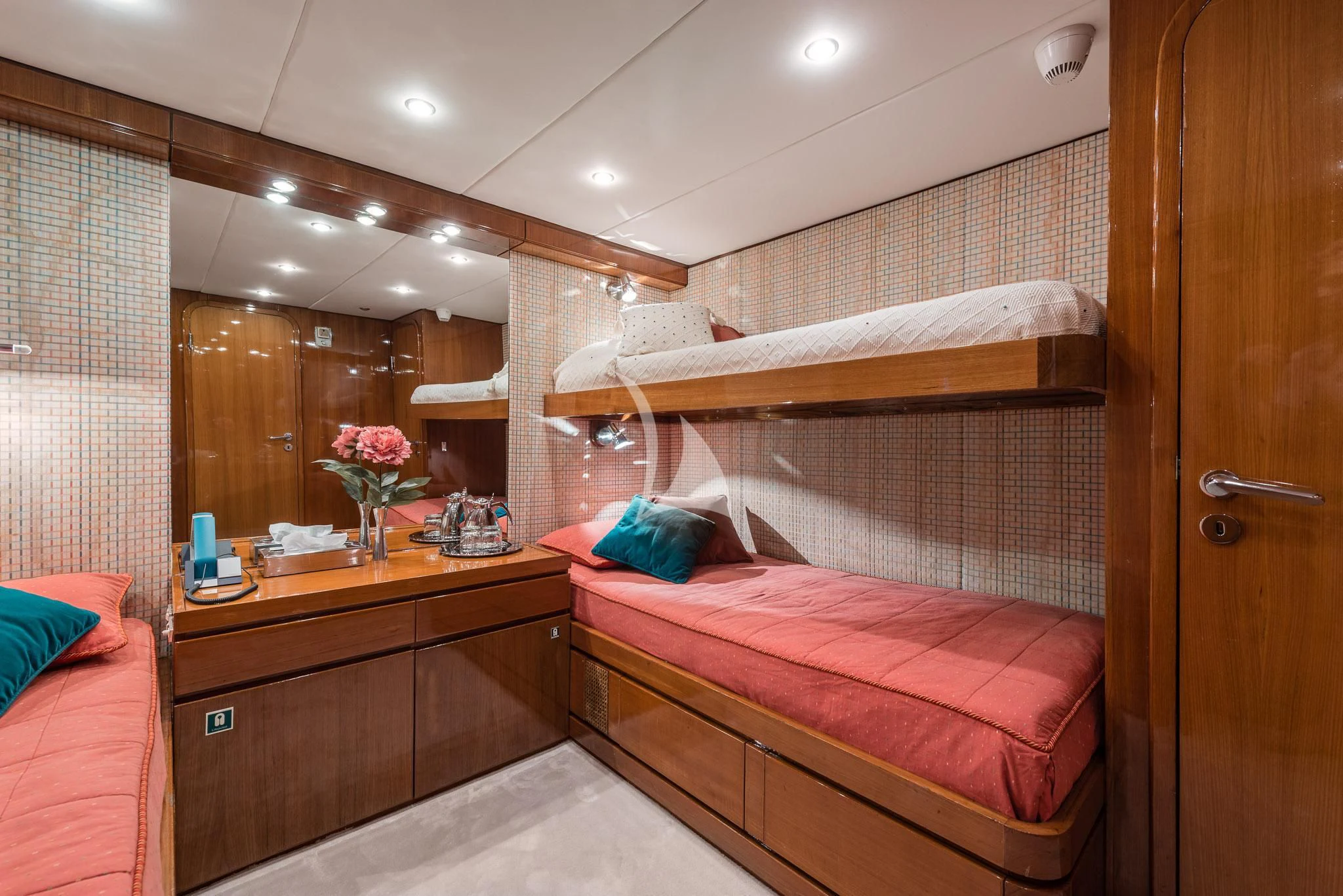 a bedroom with a bed and a mirror aboard SOUTH PAW C Yacht for Sale
