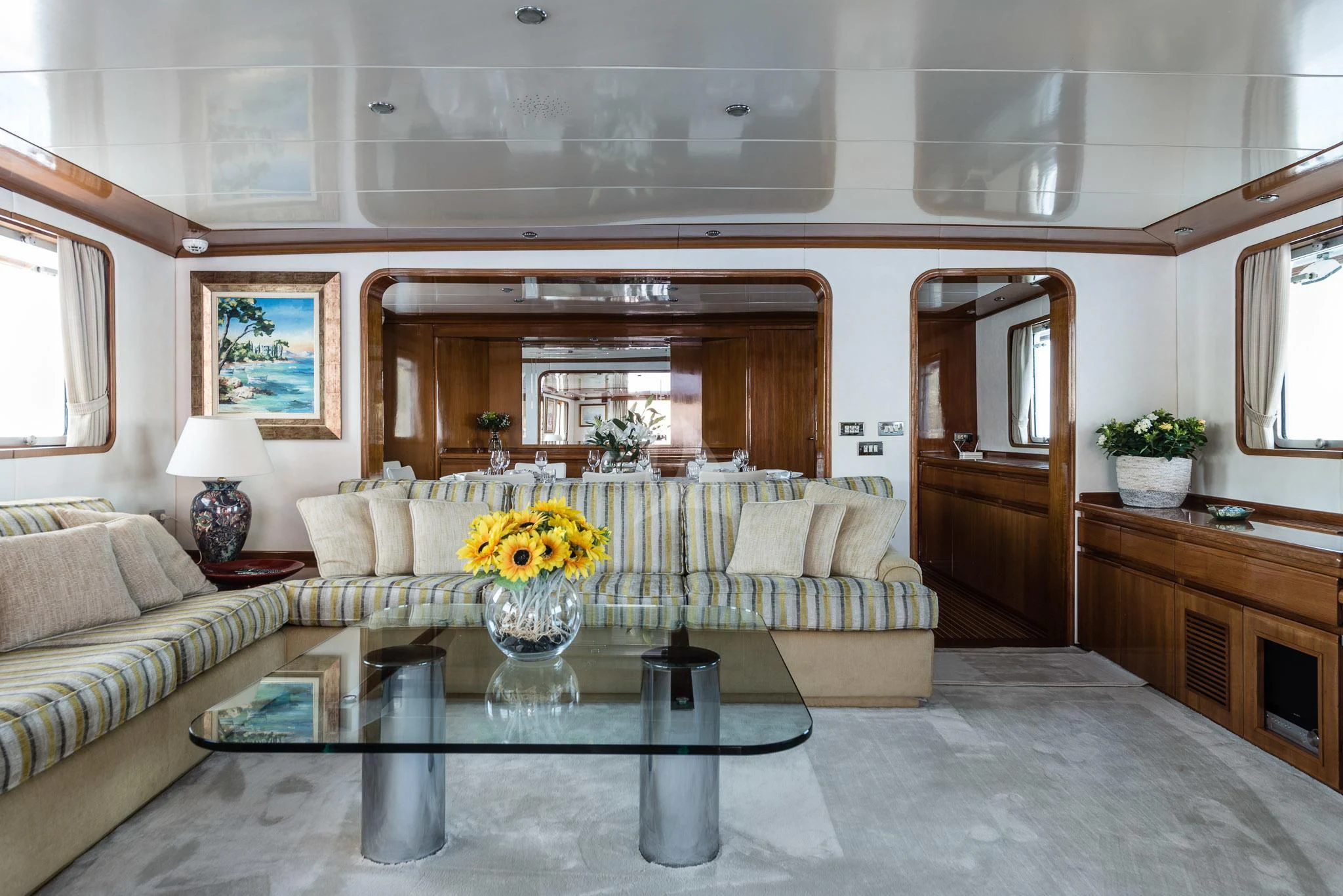 a living room with a white couch and a table aboard SOUTH PAW C Yacht for Sale