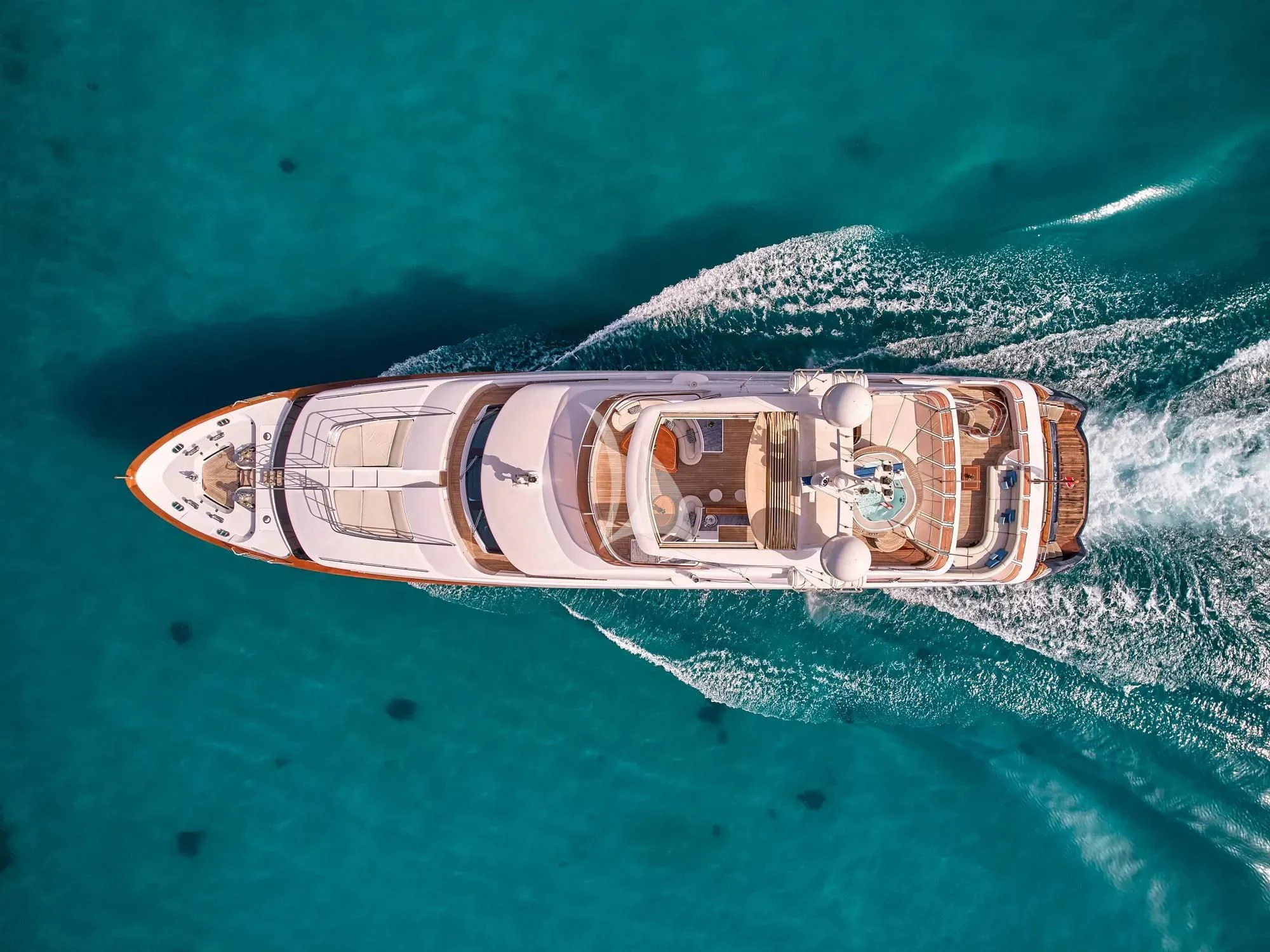 a bottle of alcohol on a leaf aboard OPTION B Yacht for Charter