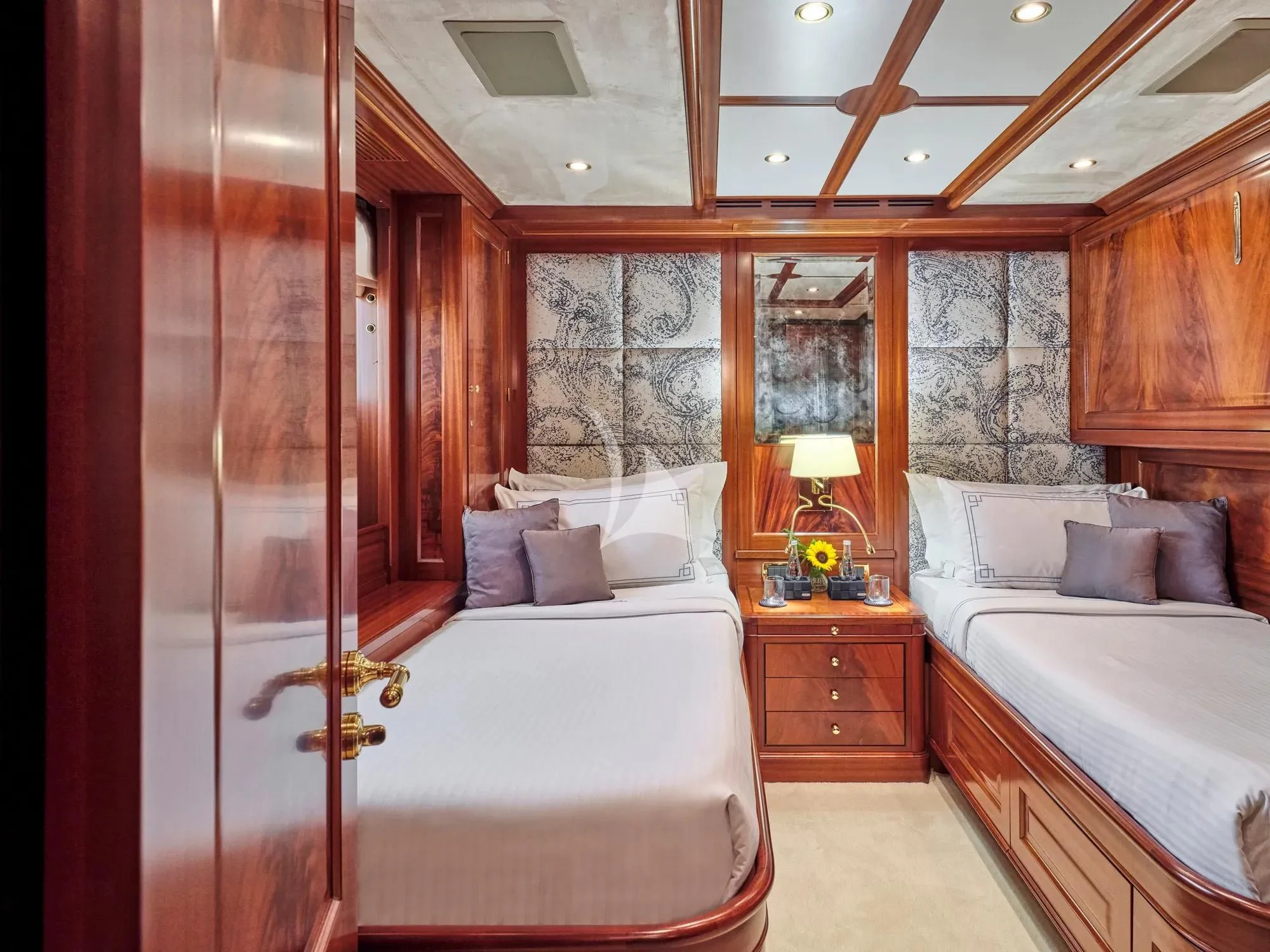 a bedroom with a bed and a closet aboard OPTION B Yacht for Charter