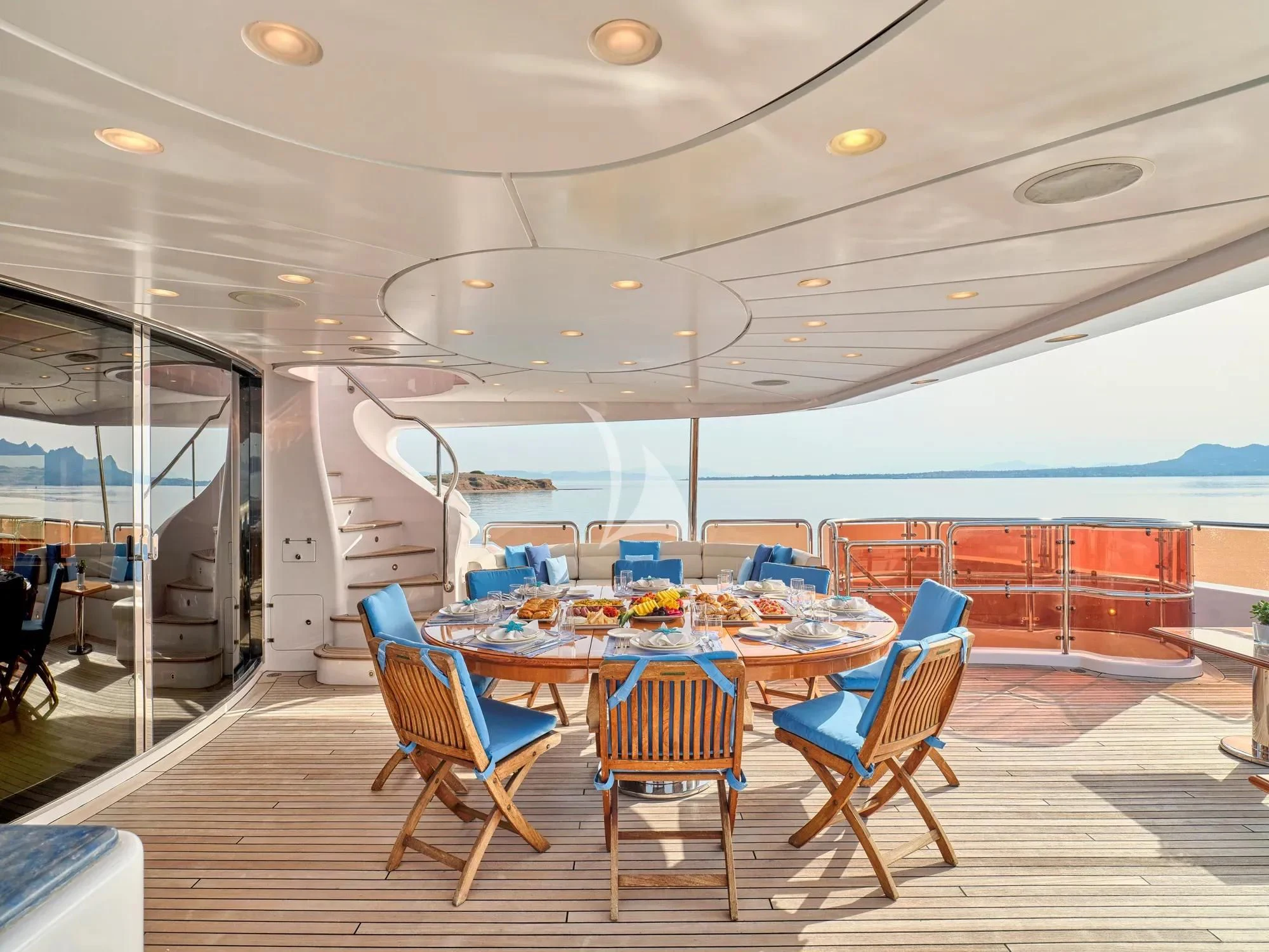 a room with a table and chairs aboard OPTION B Yacht for Charter