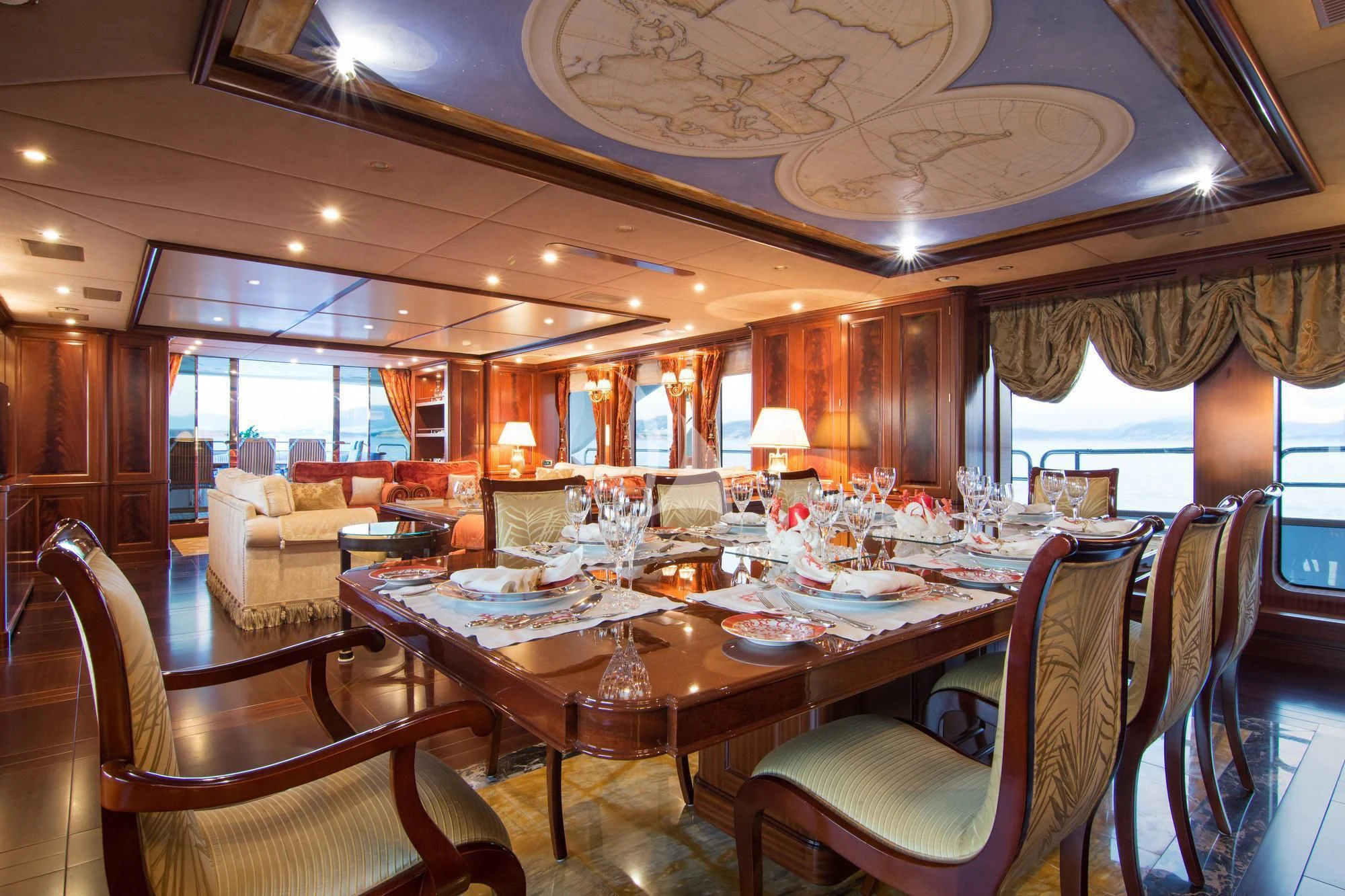 a dining room with a table and chairs aboard OPTION B Yacht for Charter