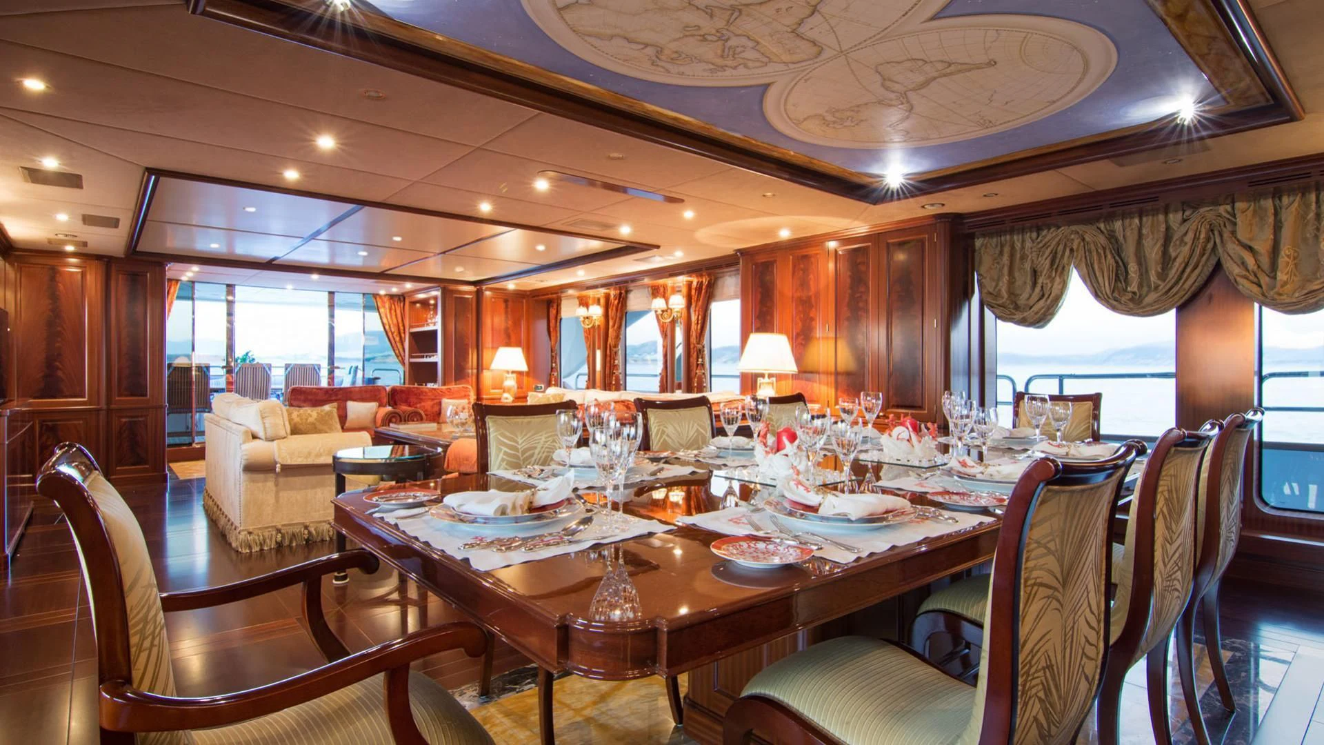 a large dining room with a large table and chairs aboard OPTION B Yacht for Charter