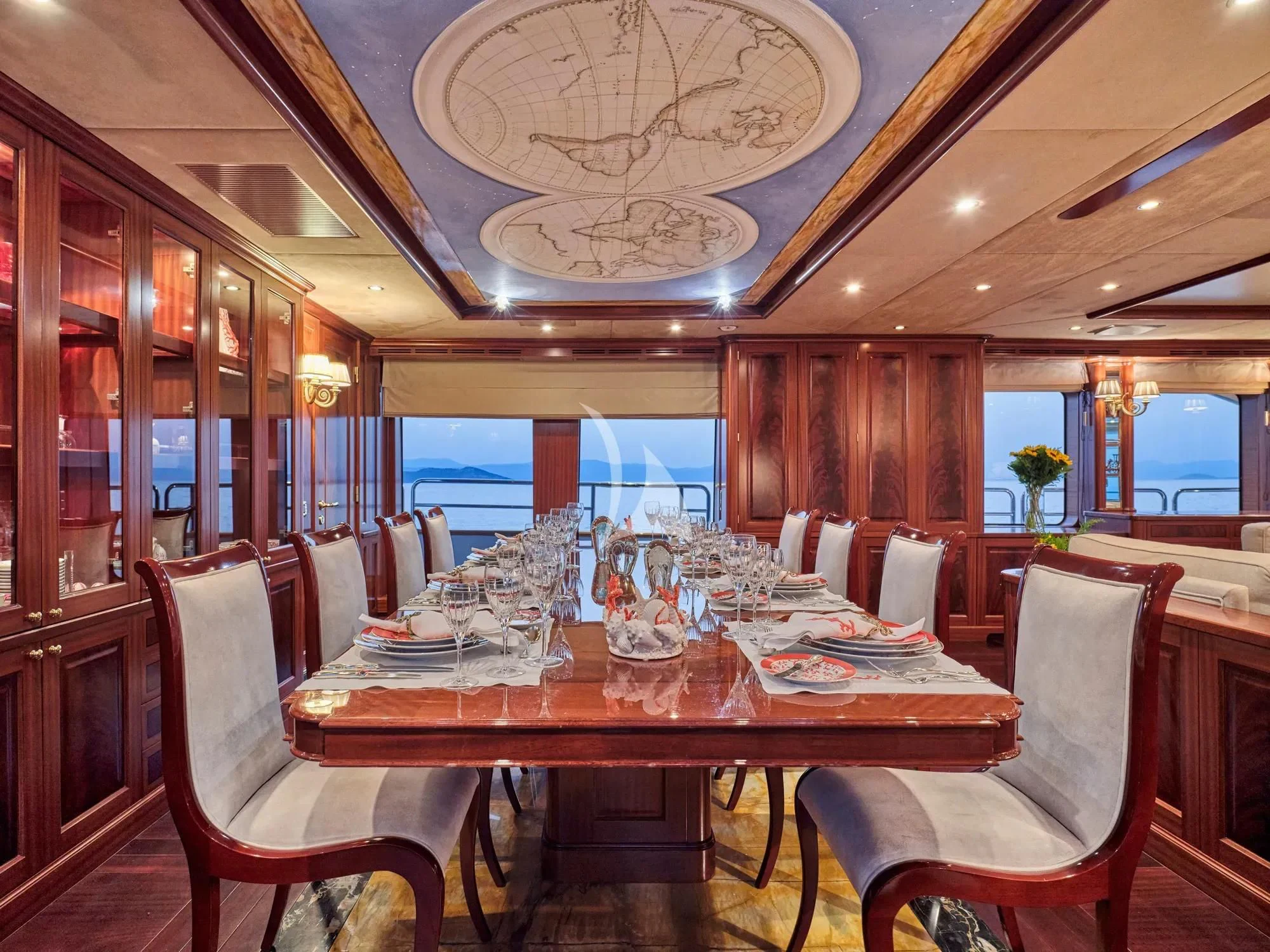 a restaurant with tables and chairs aboard OPTION B Yacht for Charter