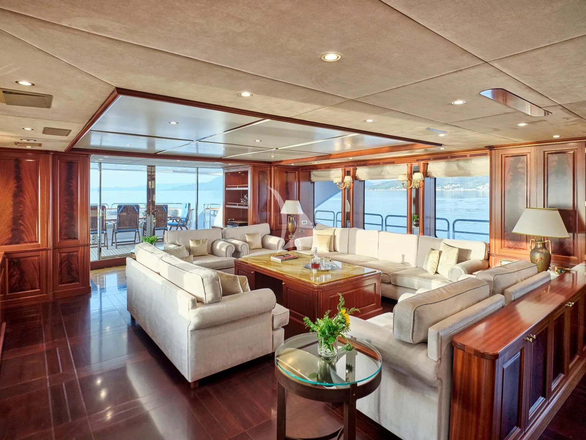 a living room with a large window aboard OPTION B Yacht for Charter