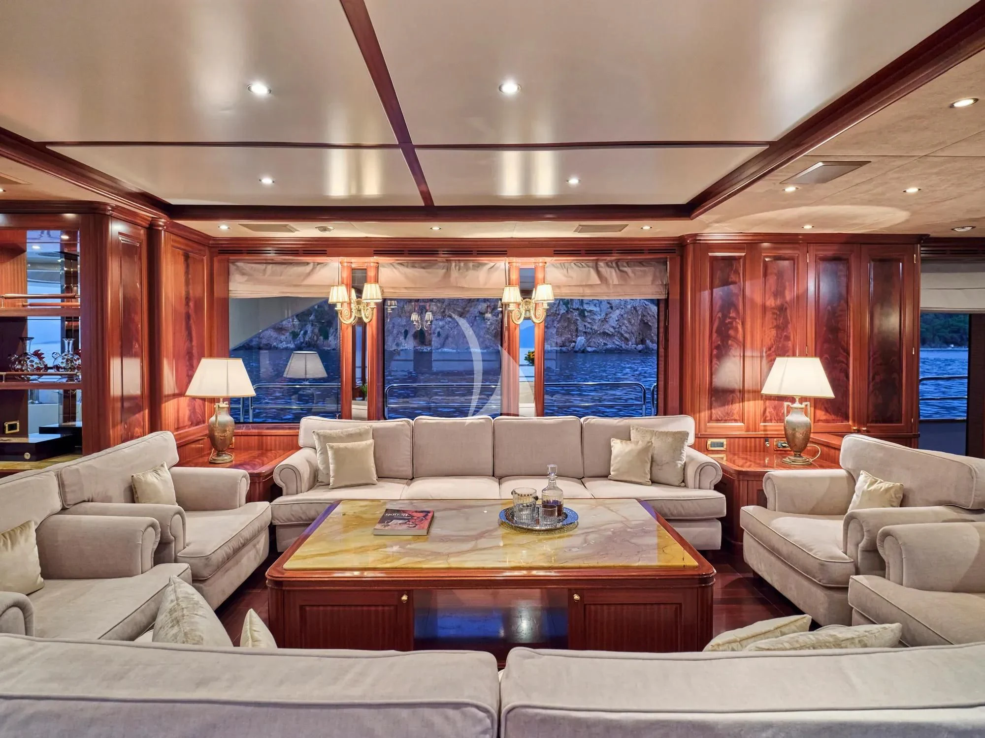 a living room with a large window aboard OPTION B Yacht for Charter