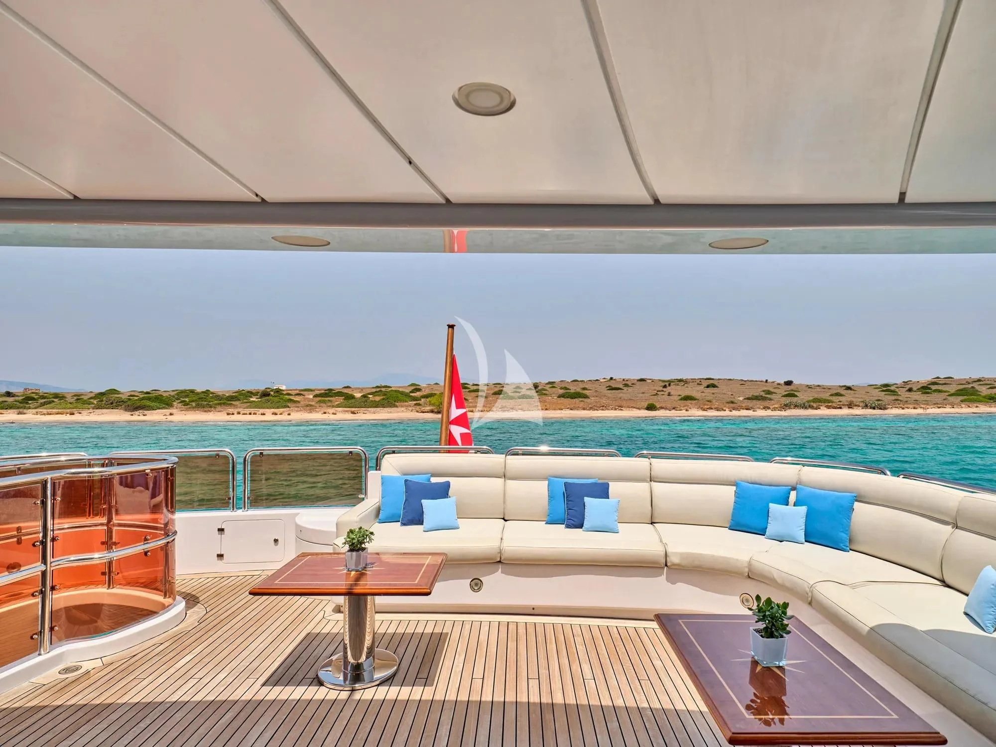 a pool with a table and chairs aboard OPTION B Yacht for Charter
