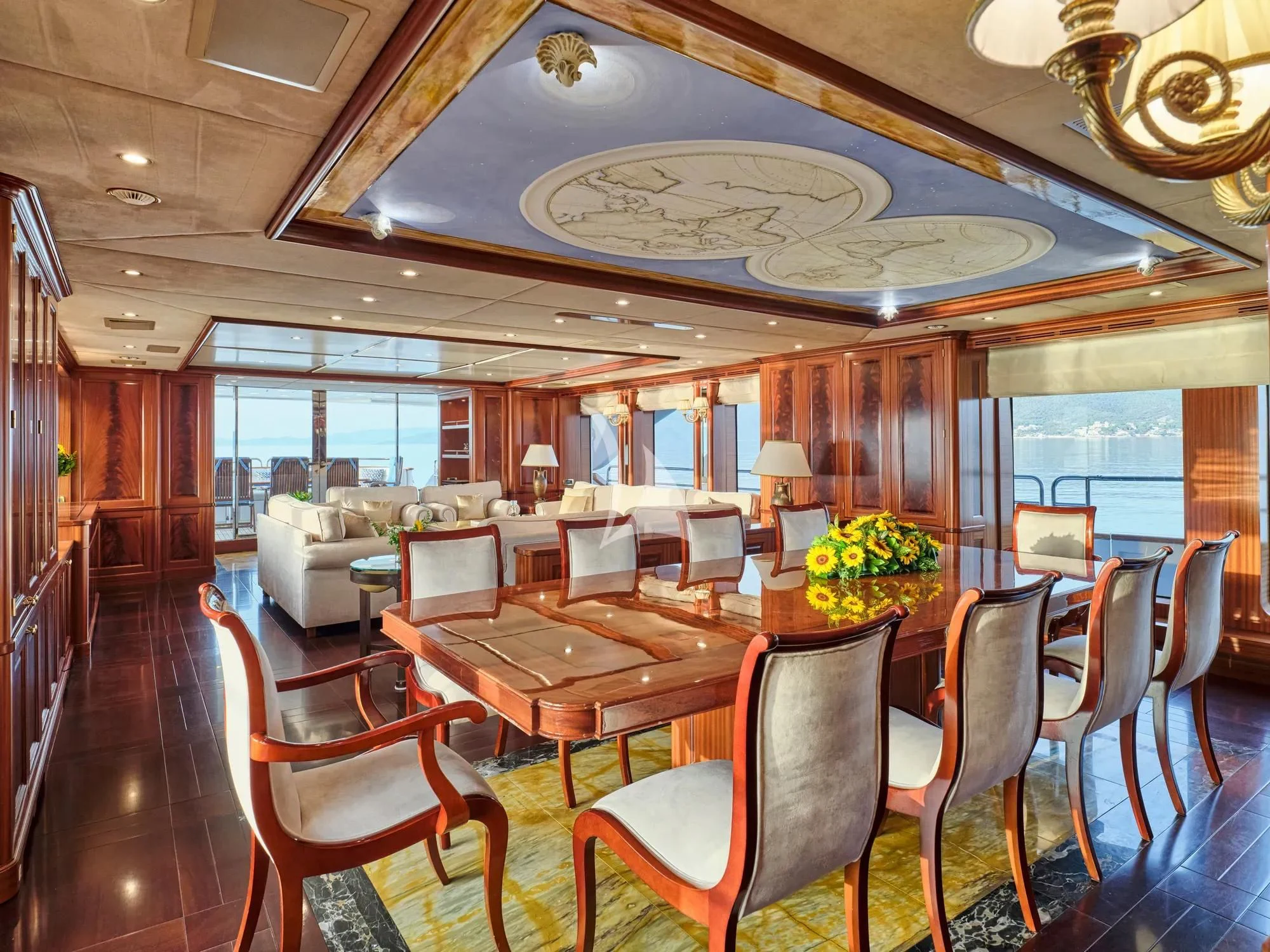 a large room with a table and chairs aboard OPTION B Yacht for Charter