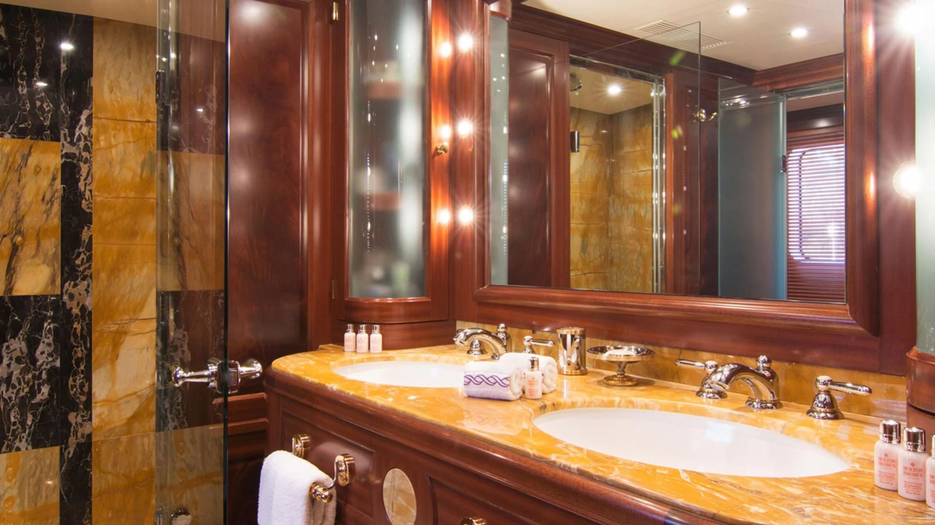 a bathroom with a large mirror aboard OPTION B Yacht for Charter