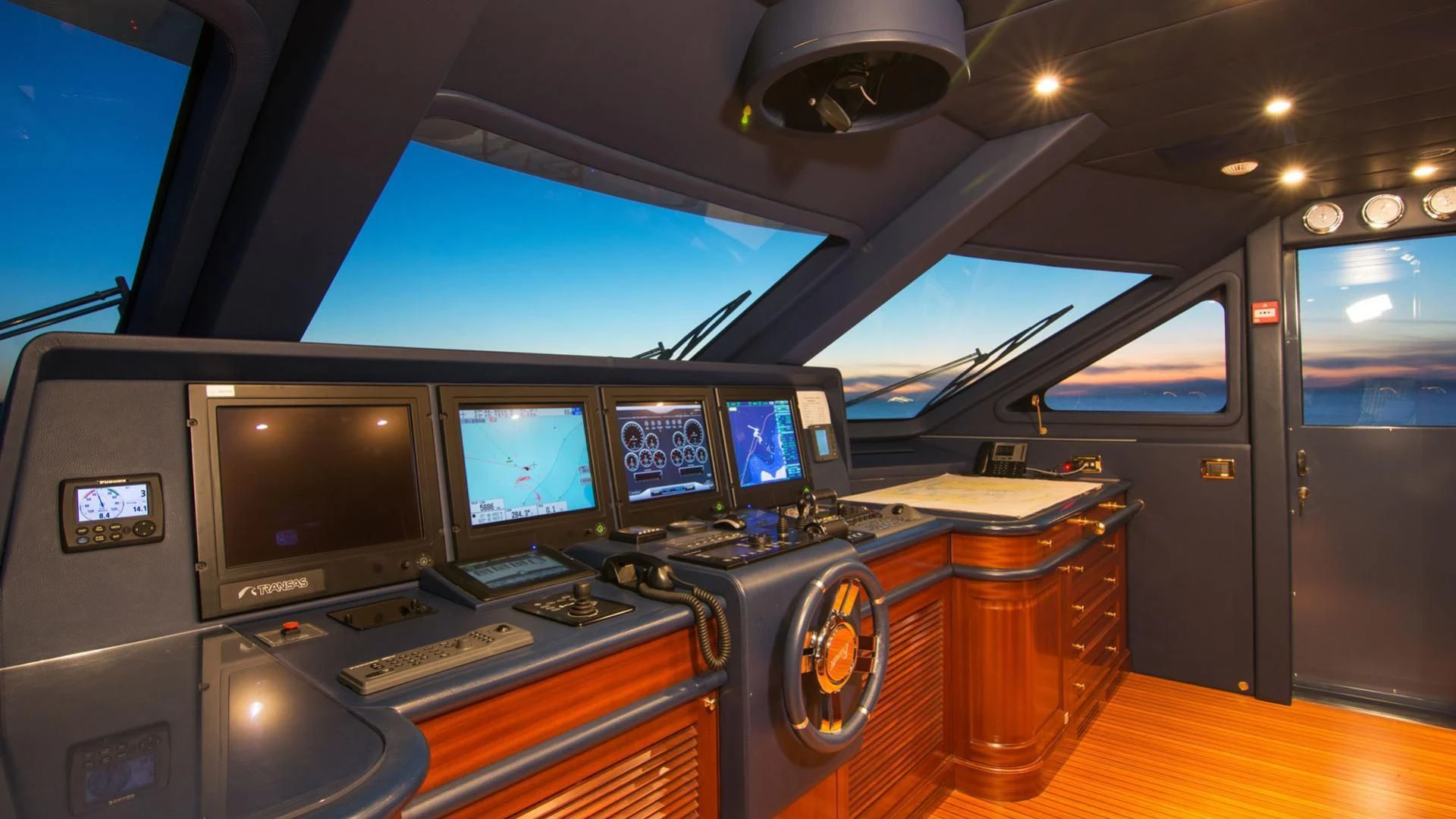 inside of a vehicle with monitors and instruments aboard OPTION B Yacht for Charter