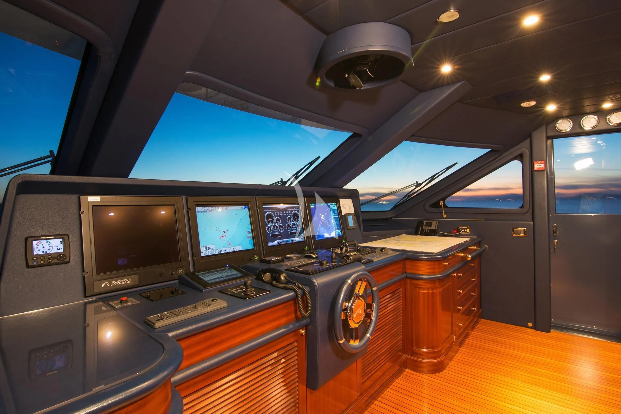 inside of a vehicle with monitors and instruments aboard OPTION B Yacht for Charter