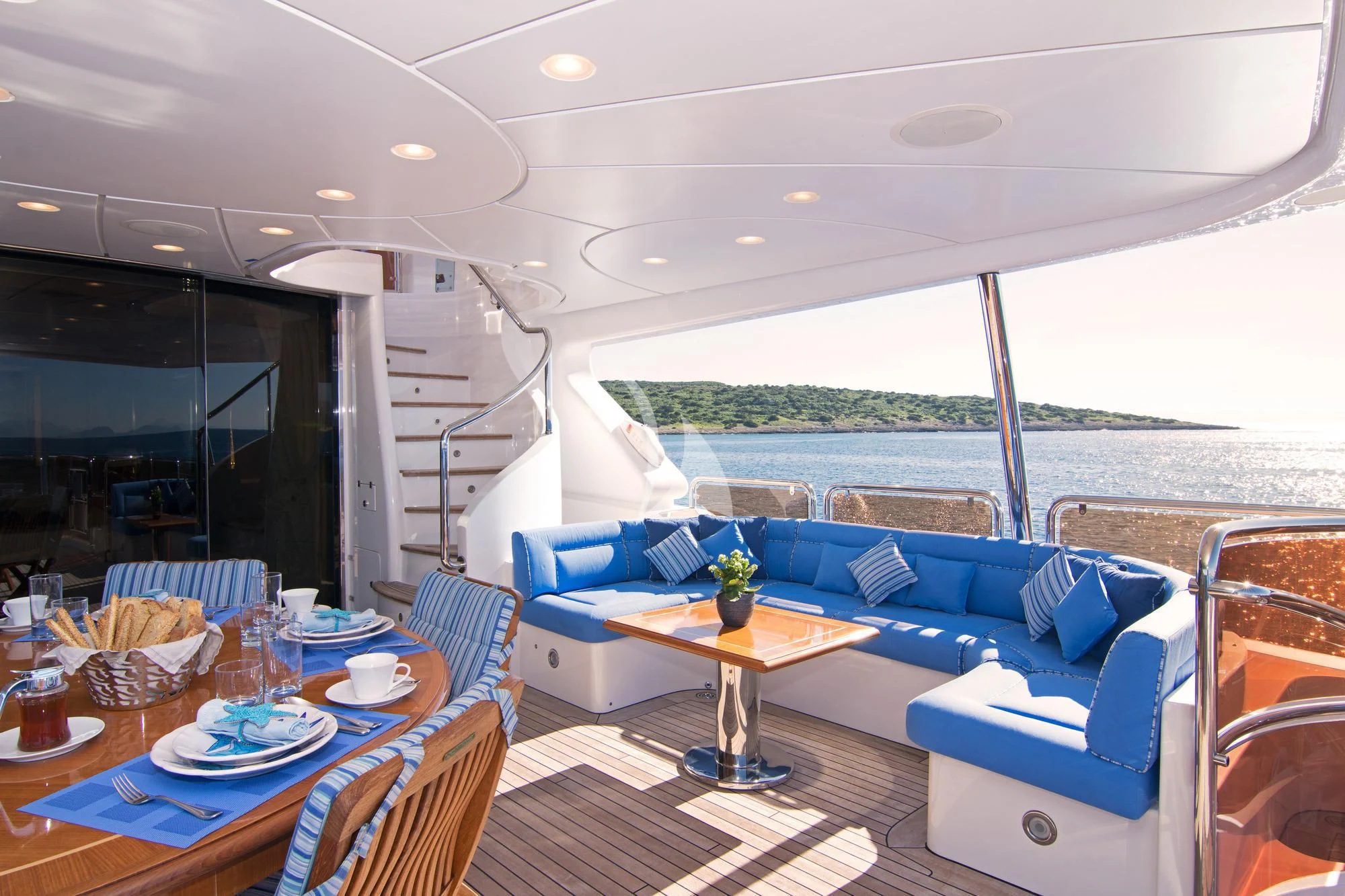 a living room with a large balcony aboard OPTION B Yacht for Charter