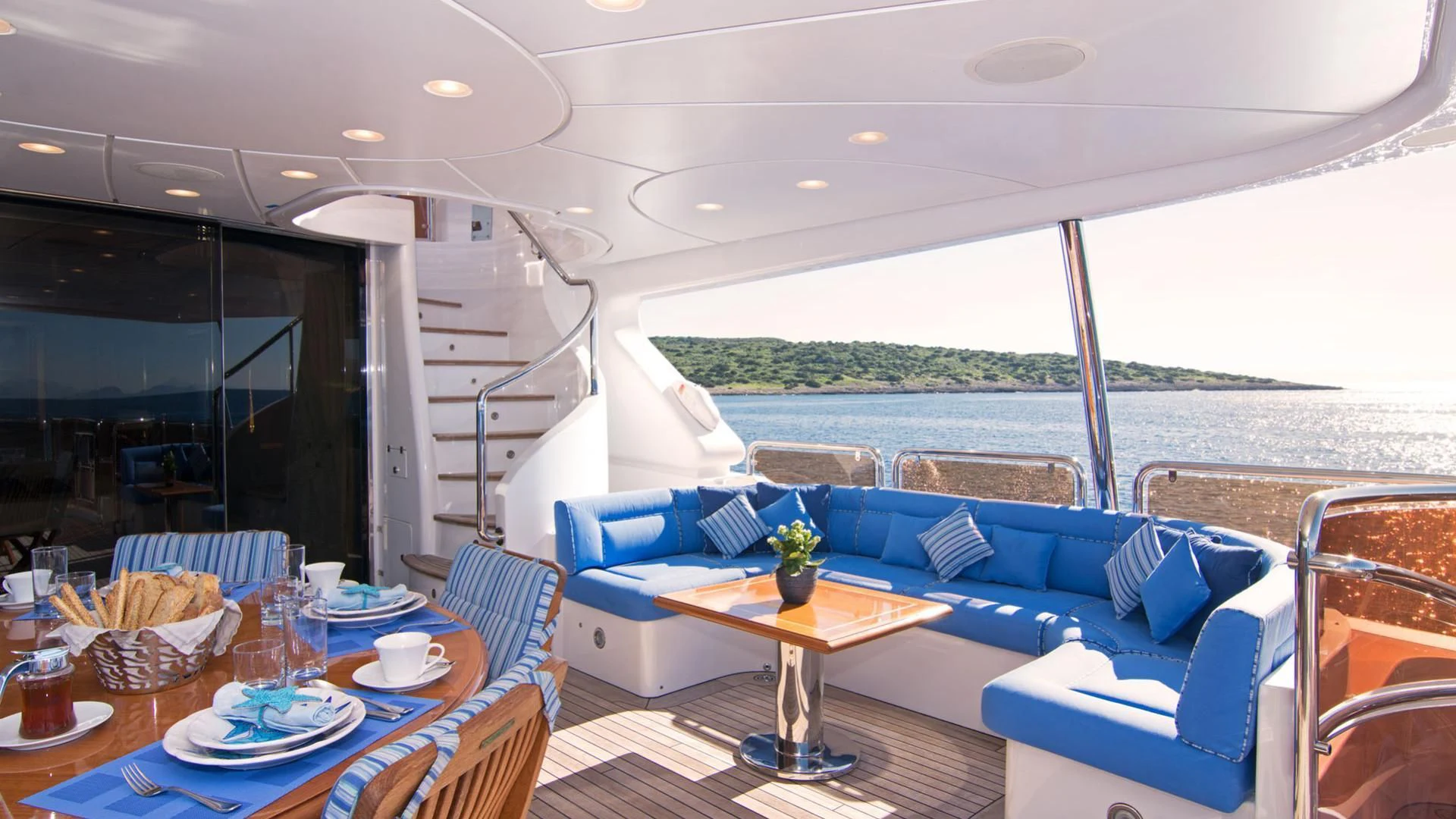 a living room with a large balcony aboard OPTION B Yacht for Charter