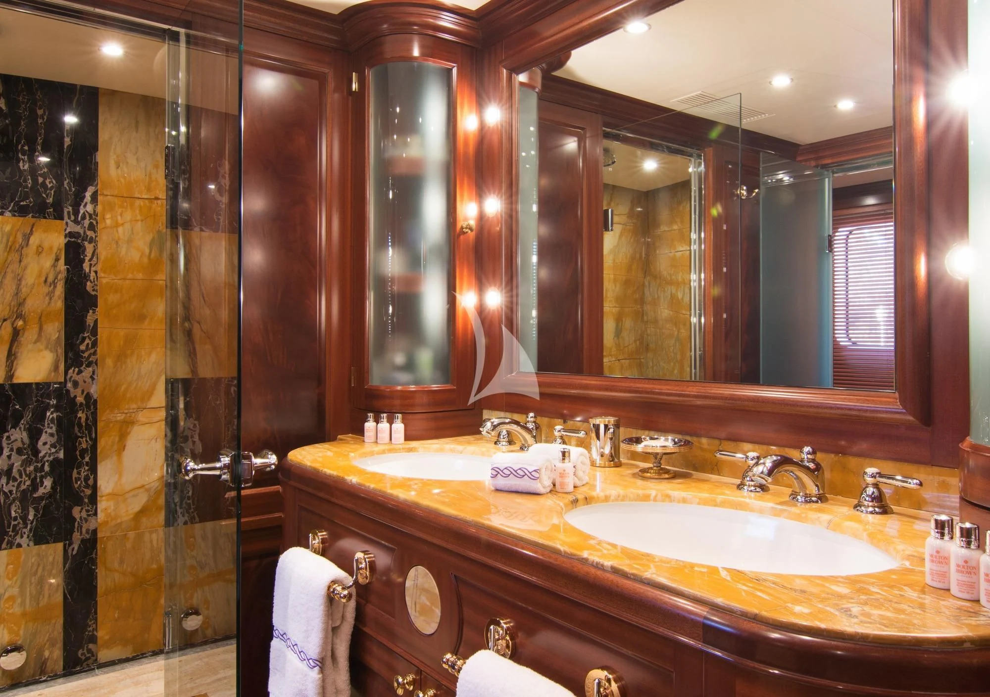 a bathroom with a large mirror aboard OPTION B Yacht for Charter