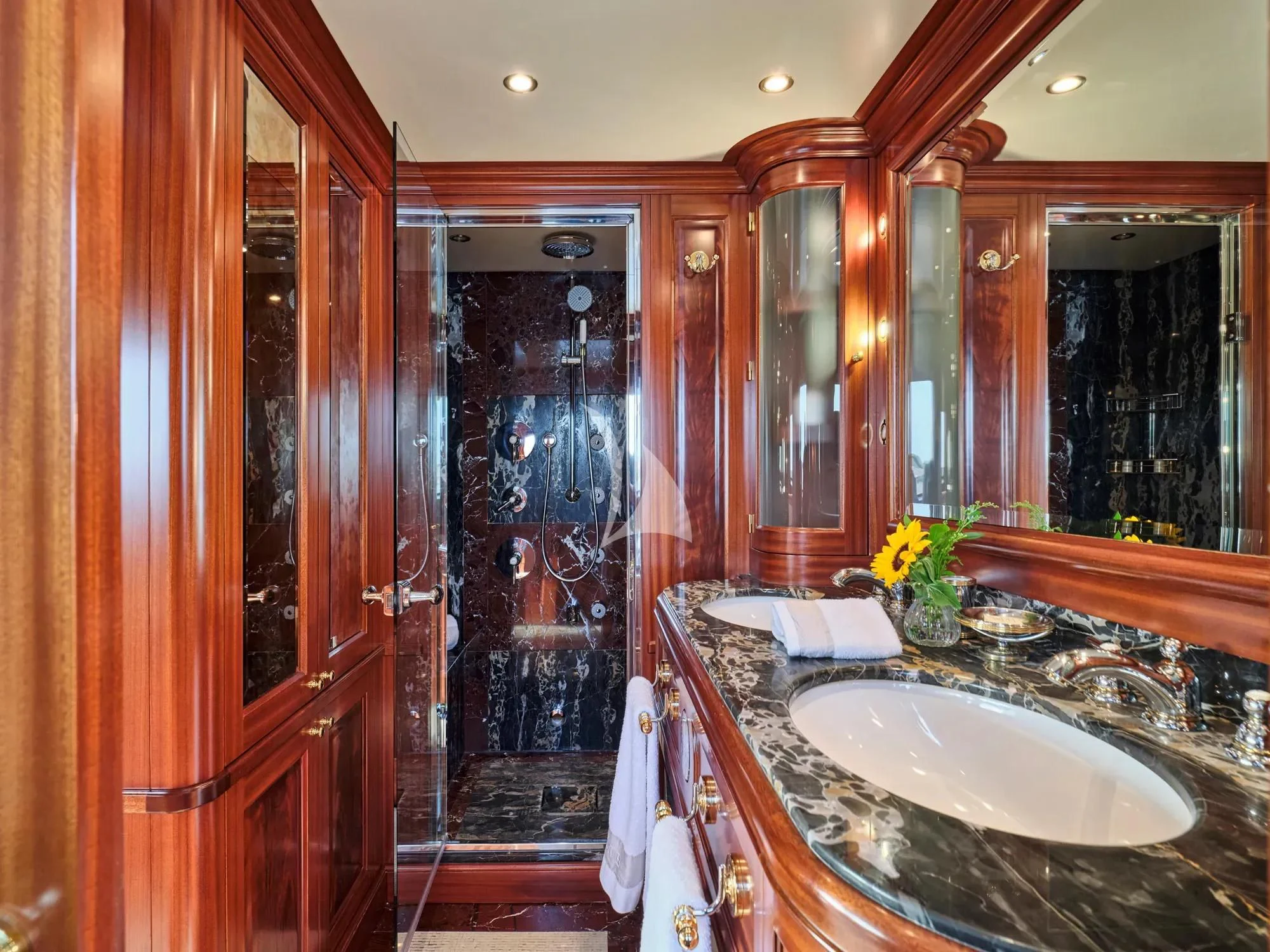 a bathroom with a sink and a mirror aboard OPTION B Yacht for Charter