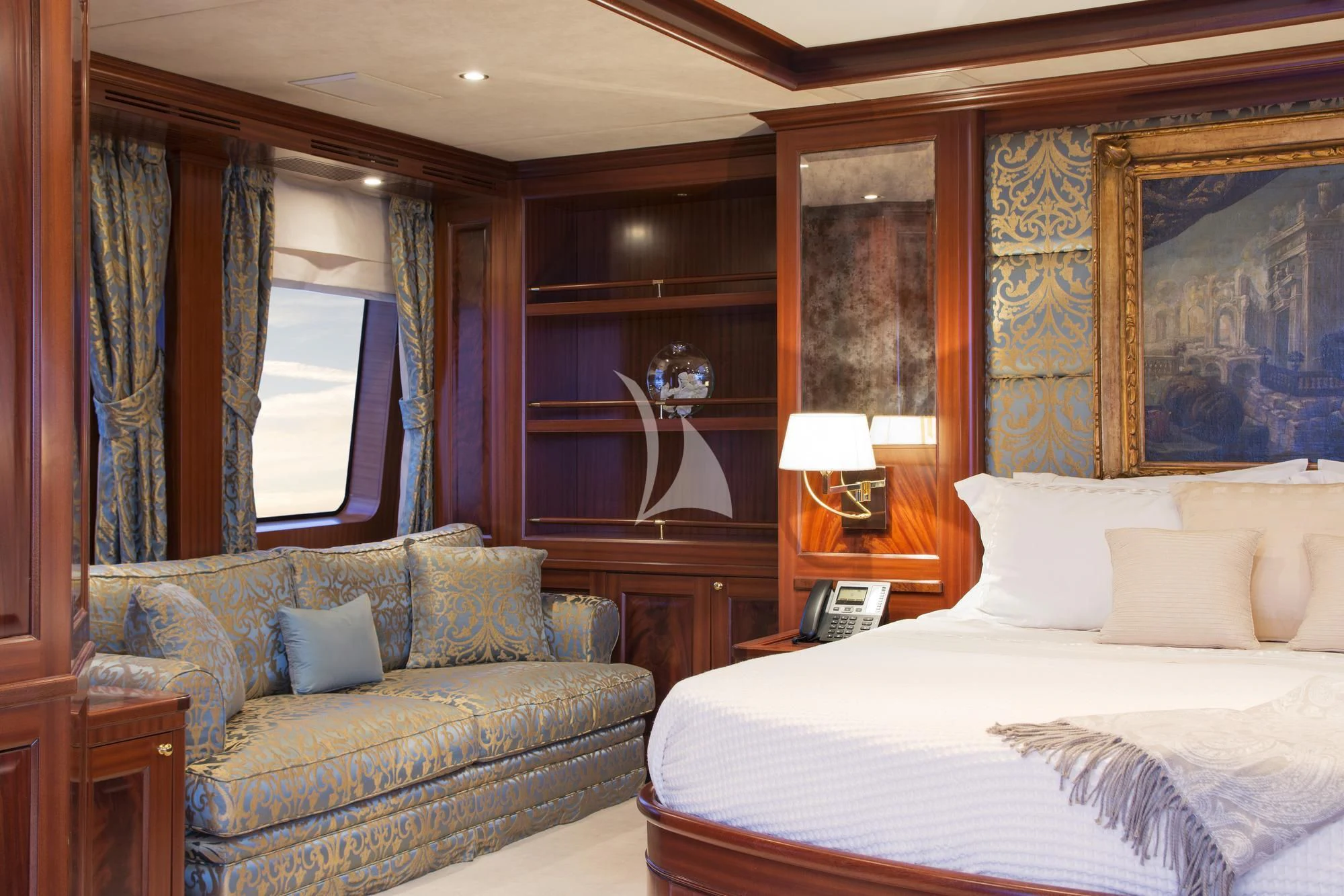 a bedroom with a bed and a couch aboard OPTION B Yacht for Charter