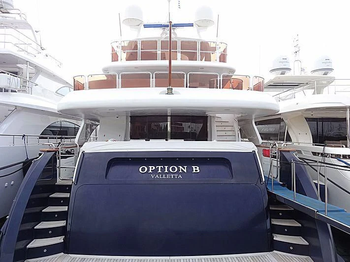 a boat with a blue cover aboard OPTION B Yacht for Charter