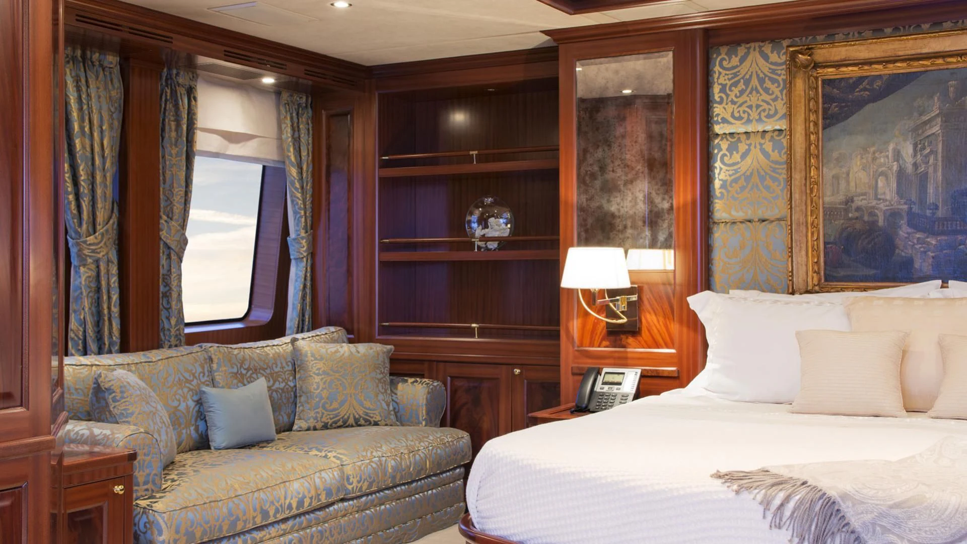 a bedroom with a bed and a couch aboard OPTION B Yacht for Charter