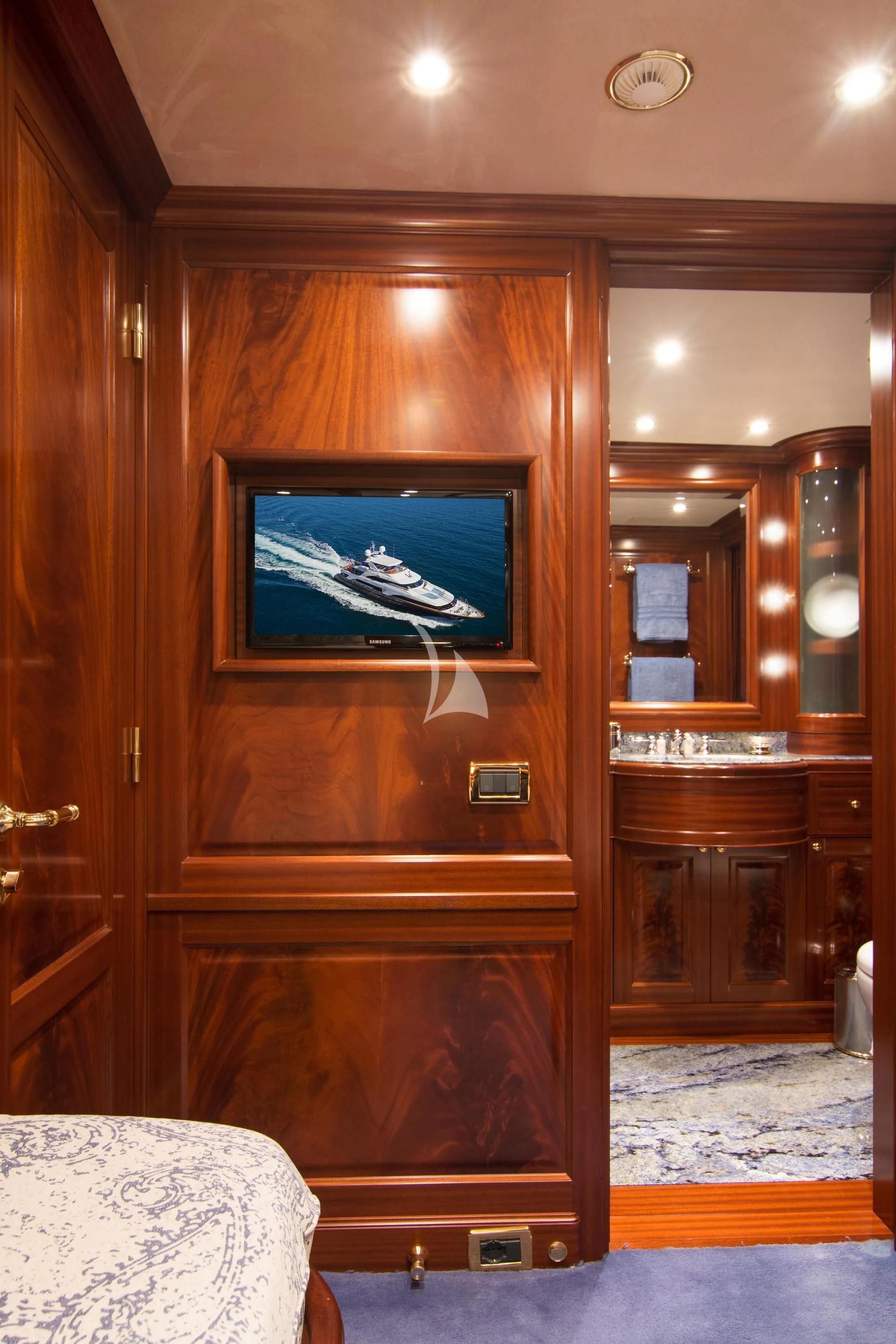 a tv on a cabinet aboard OPTION B Yacht for Charter