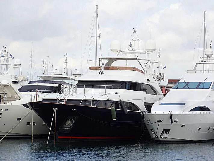 several white yachts in the water aboard OPTION B Yacht for Charter