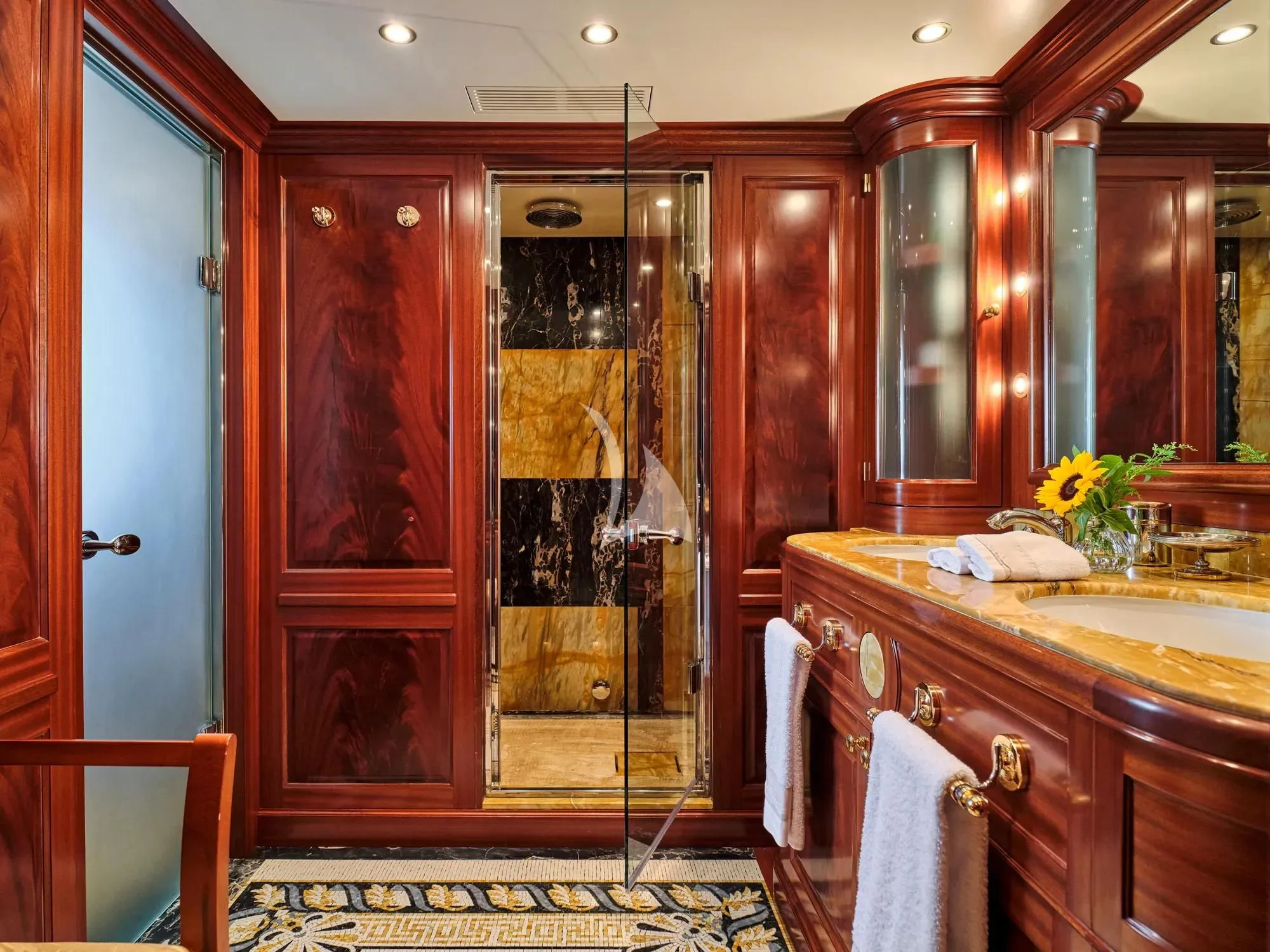 a bathroom with a large shower unit aboard OPTION B Yacht for Charter