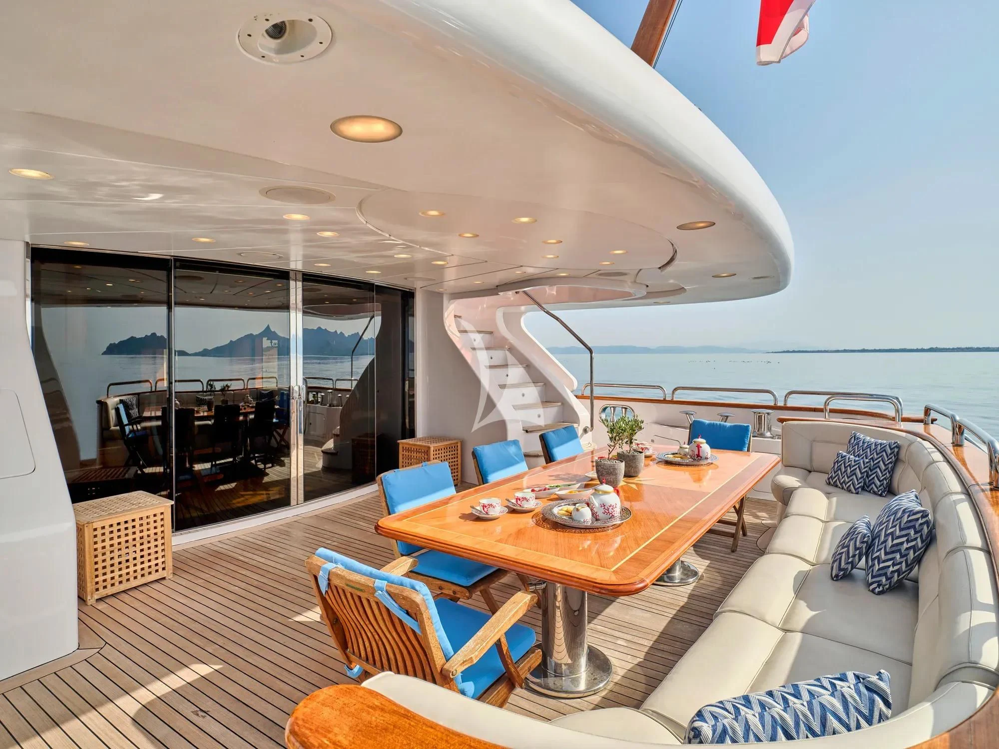 a living room with a large balcony aboard OPTION B Yacht for Charter