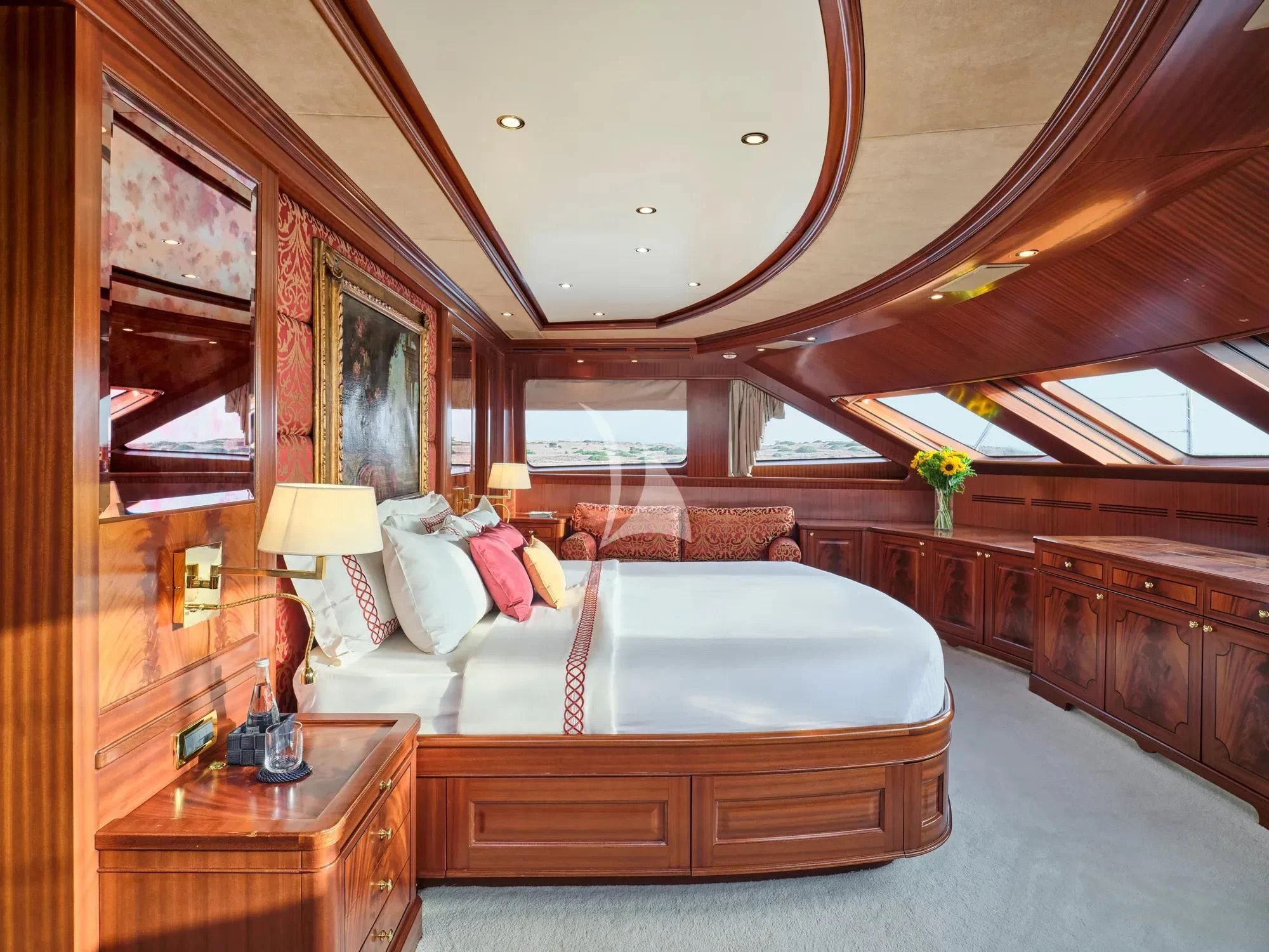 a bedroom with a large bed aboard OPTION B Yacht for Charter