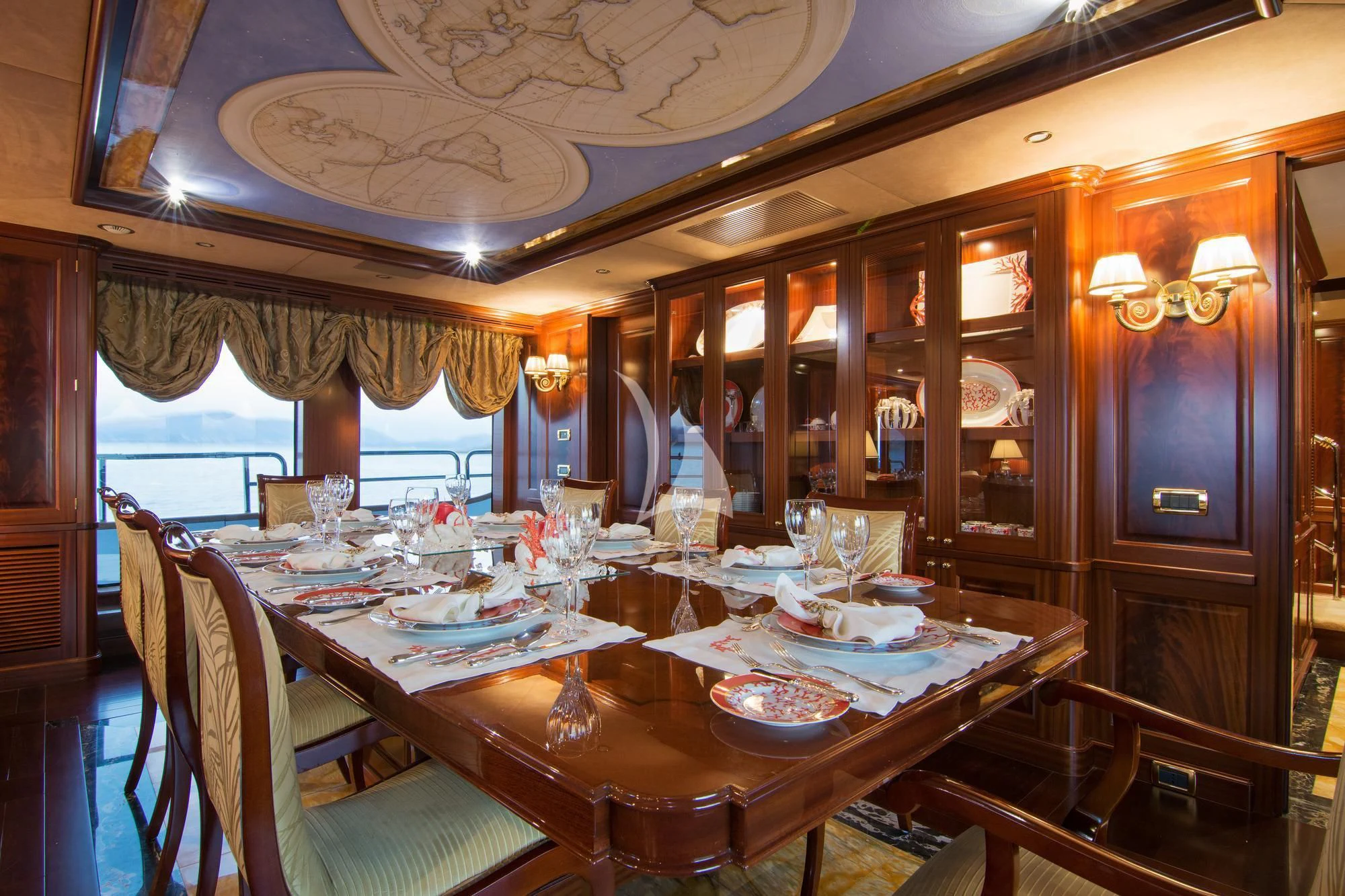 a dining room with a table set aboard OPTION B Yacht for Charter