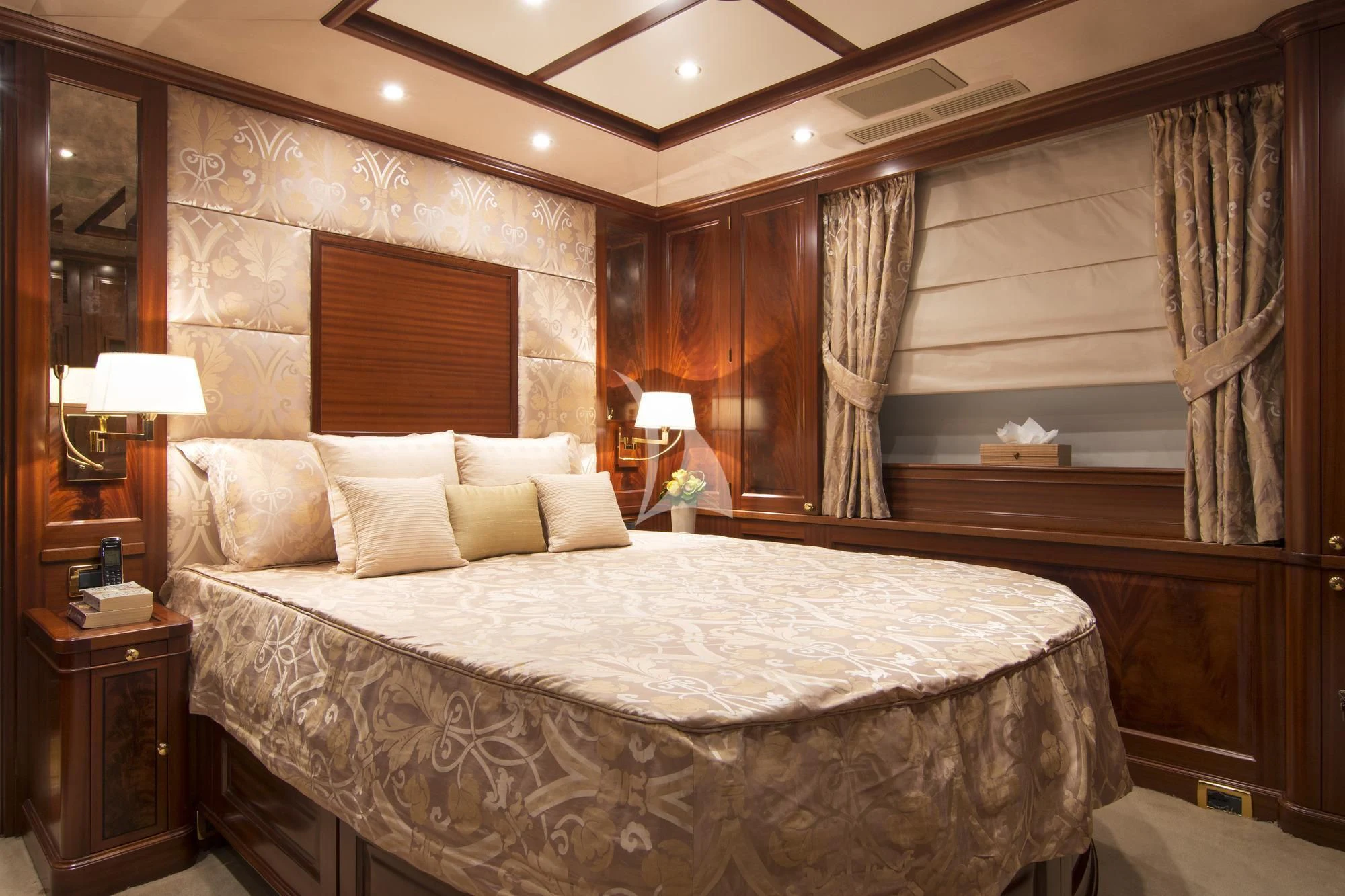 a large bed in a hotel room aboard OPTION B Yacht for Charter