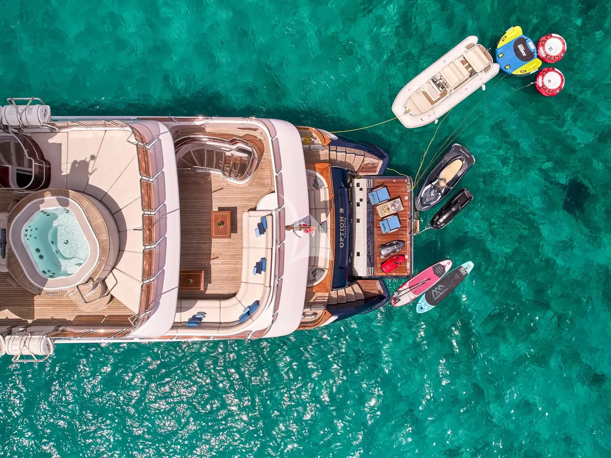 a group of fans on a green background aboard OPTION B Yacht for Charter