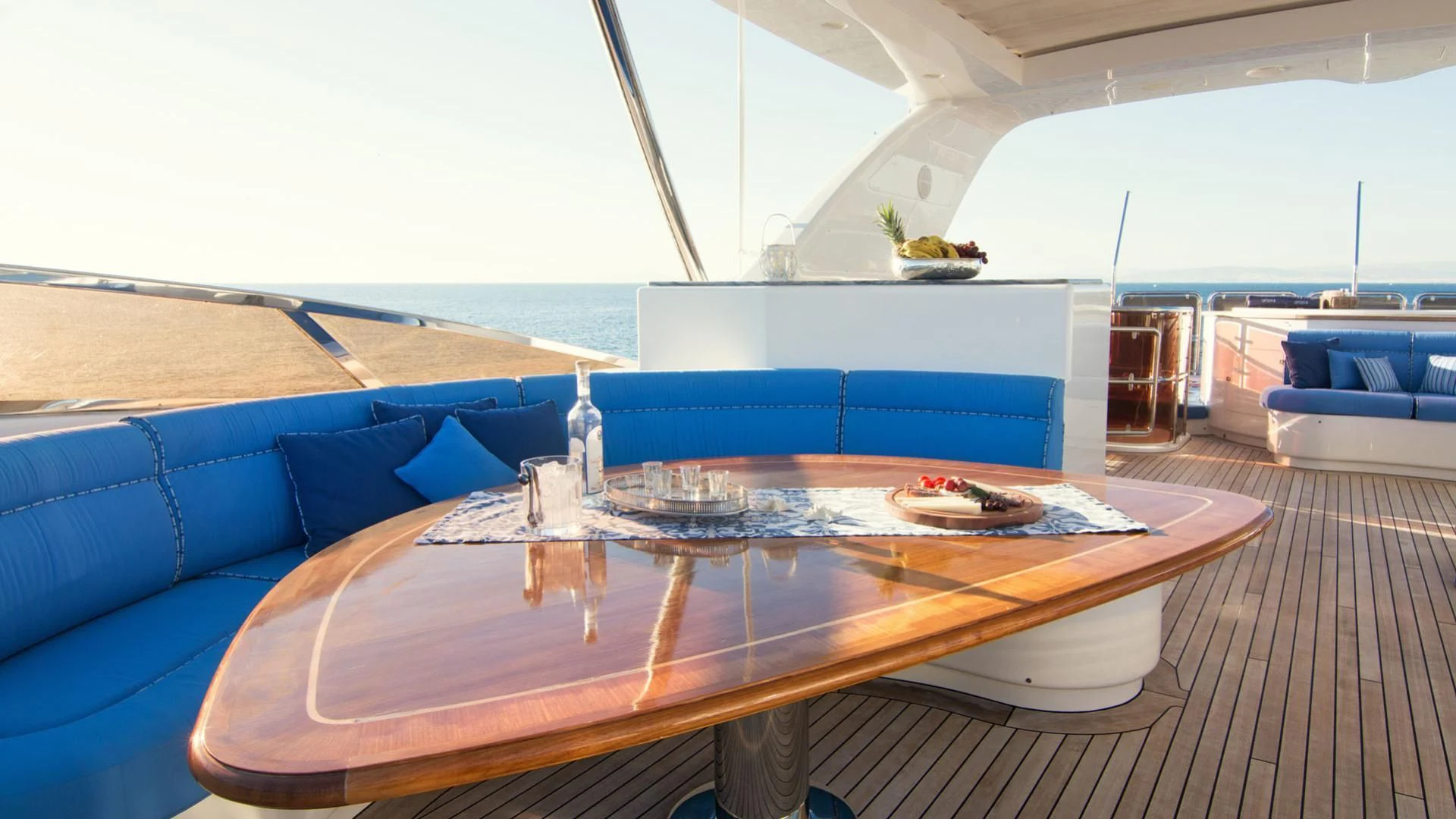 a table on a deck aboard OPTION B Yacht for Charter