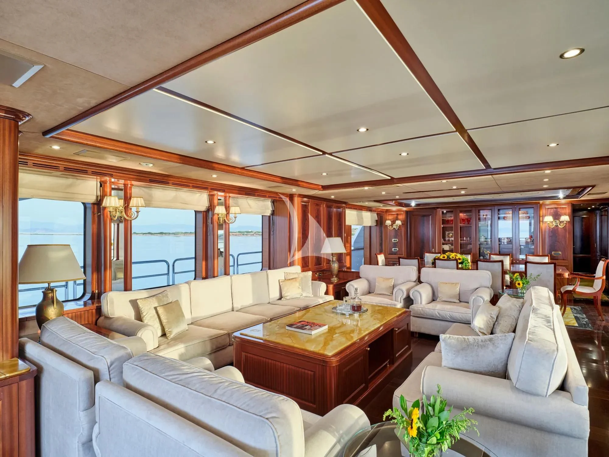 a living room with a large window aboard OPTION B Yacht for Charter