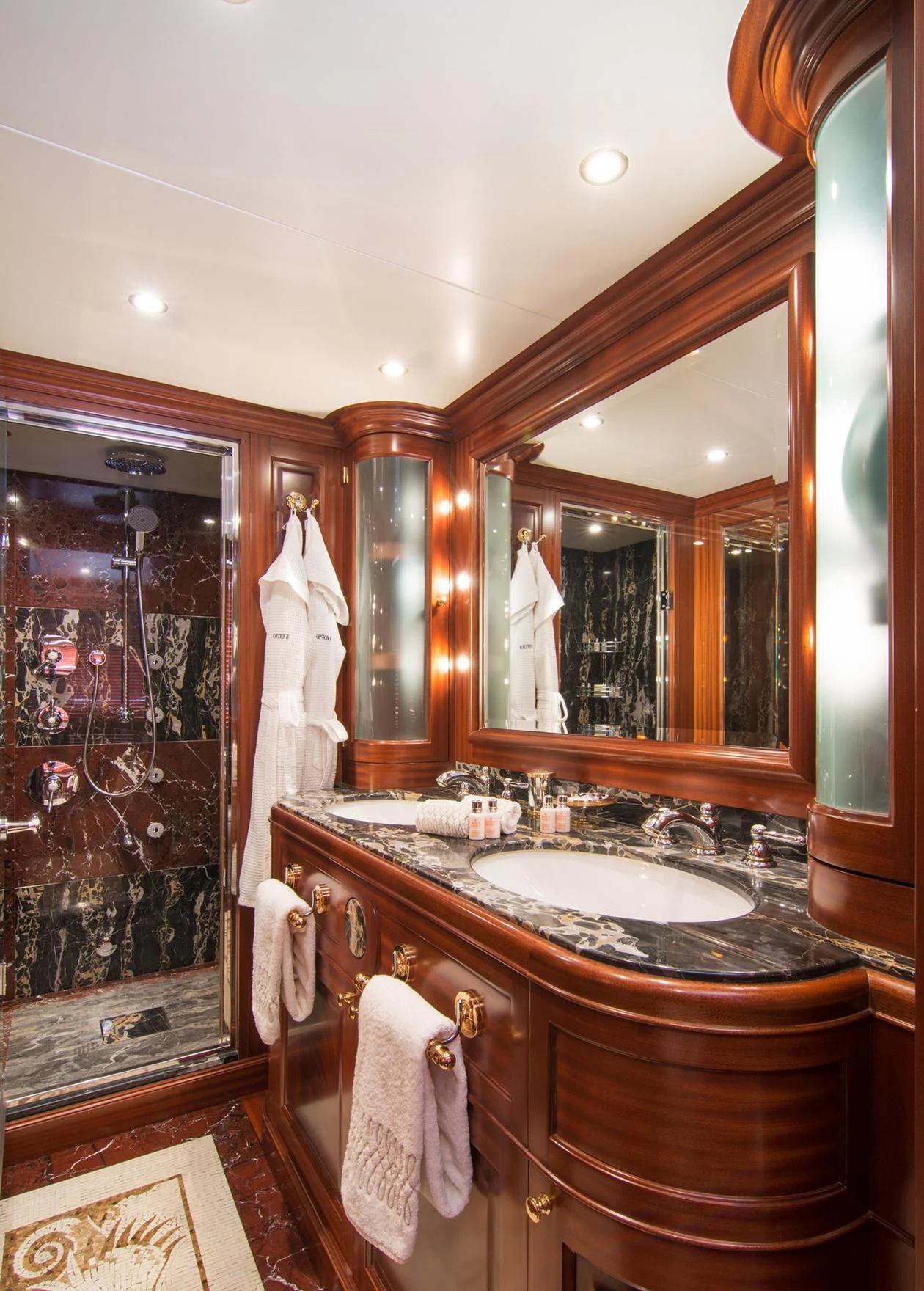 a bathroom with a large mirror aboard OPTION B Yacht for Charter