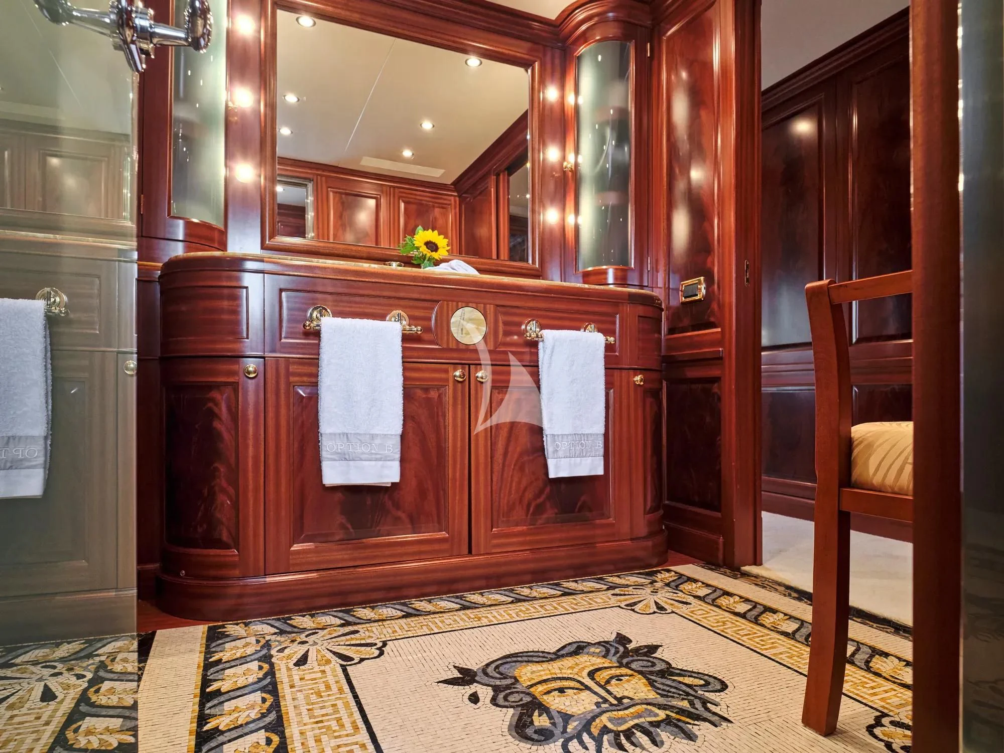 a bathroom with a wood cabinet aboard OPTION B Yacht for Charter